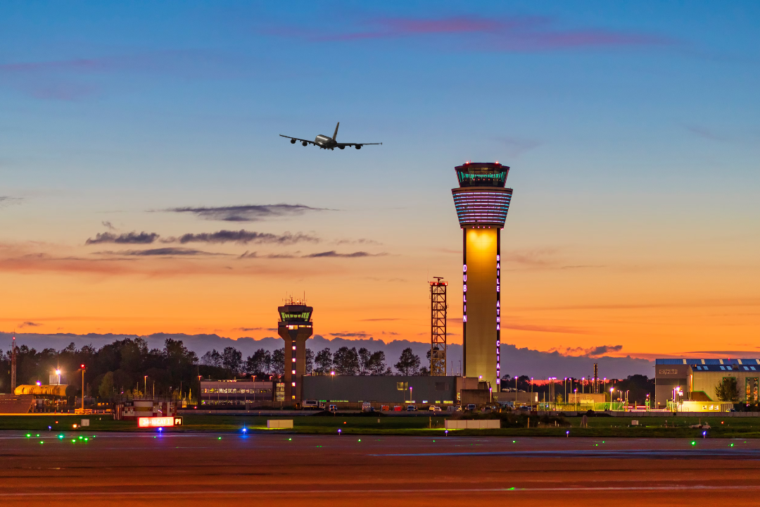 A clear night at Dublin Airport with a quad engine aircraft taking off 