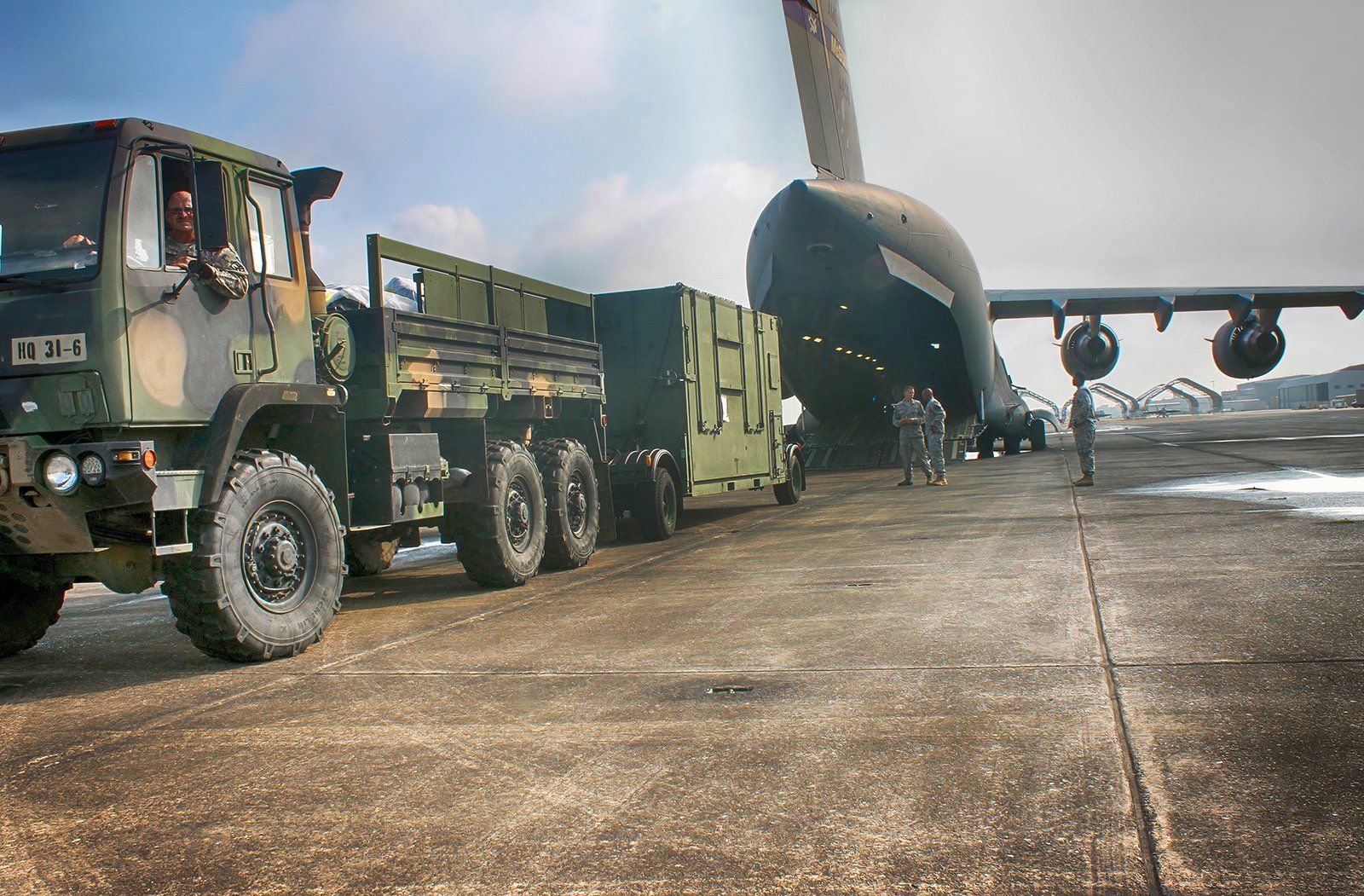 C-17 of the 635th Supply Chain Operations Wing unloading equipment