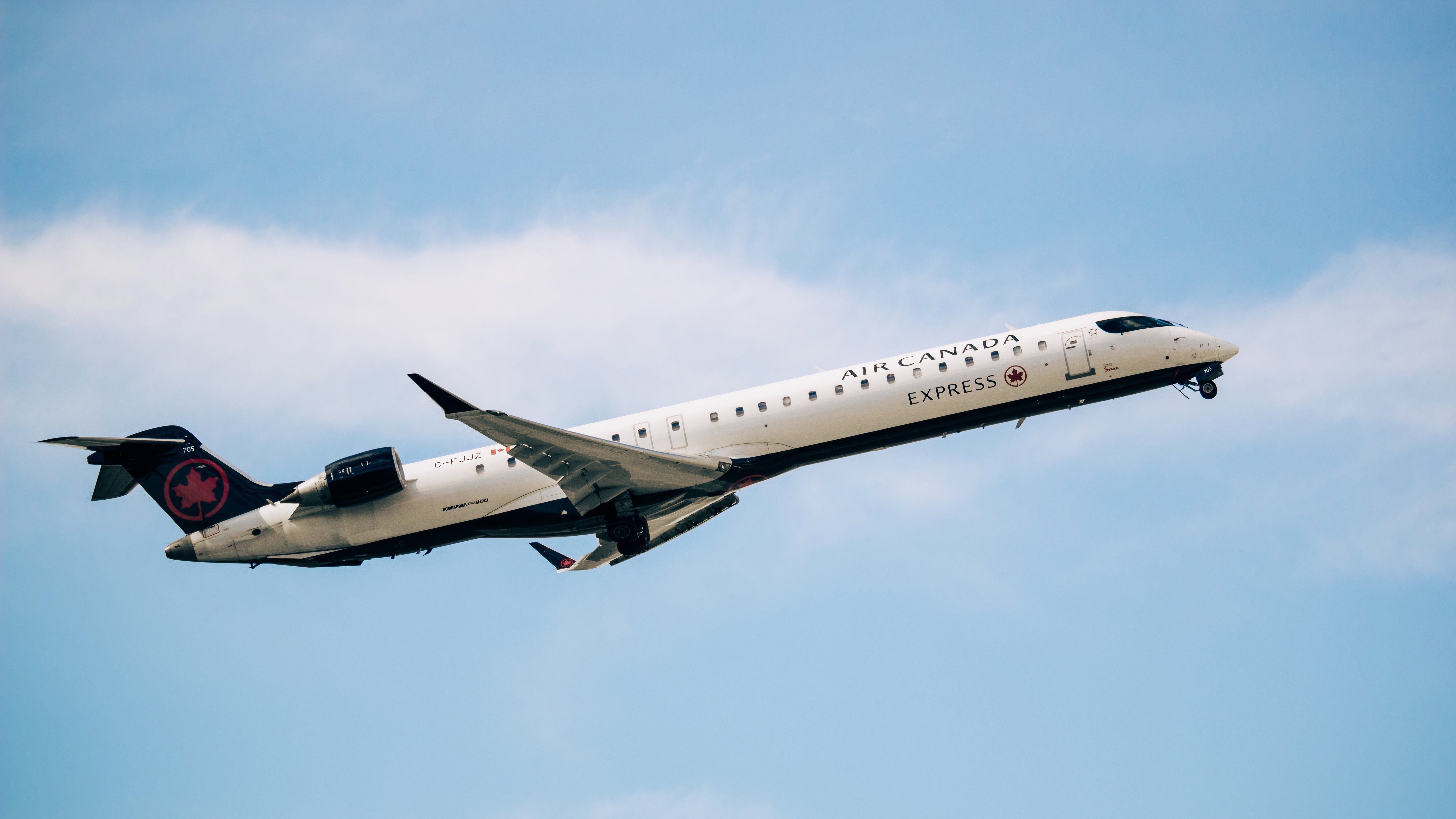 Air Canada CRJ900 flying Ethan Gillmore Shutterstock 169