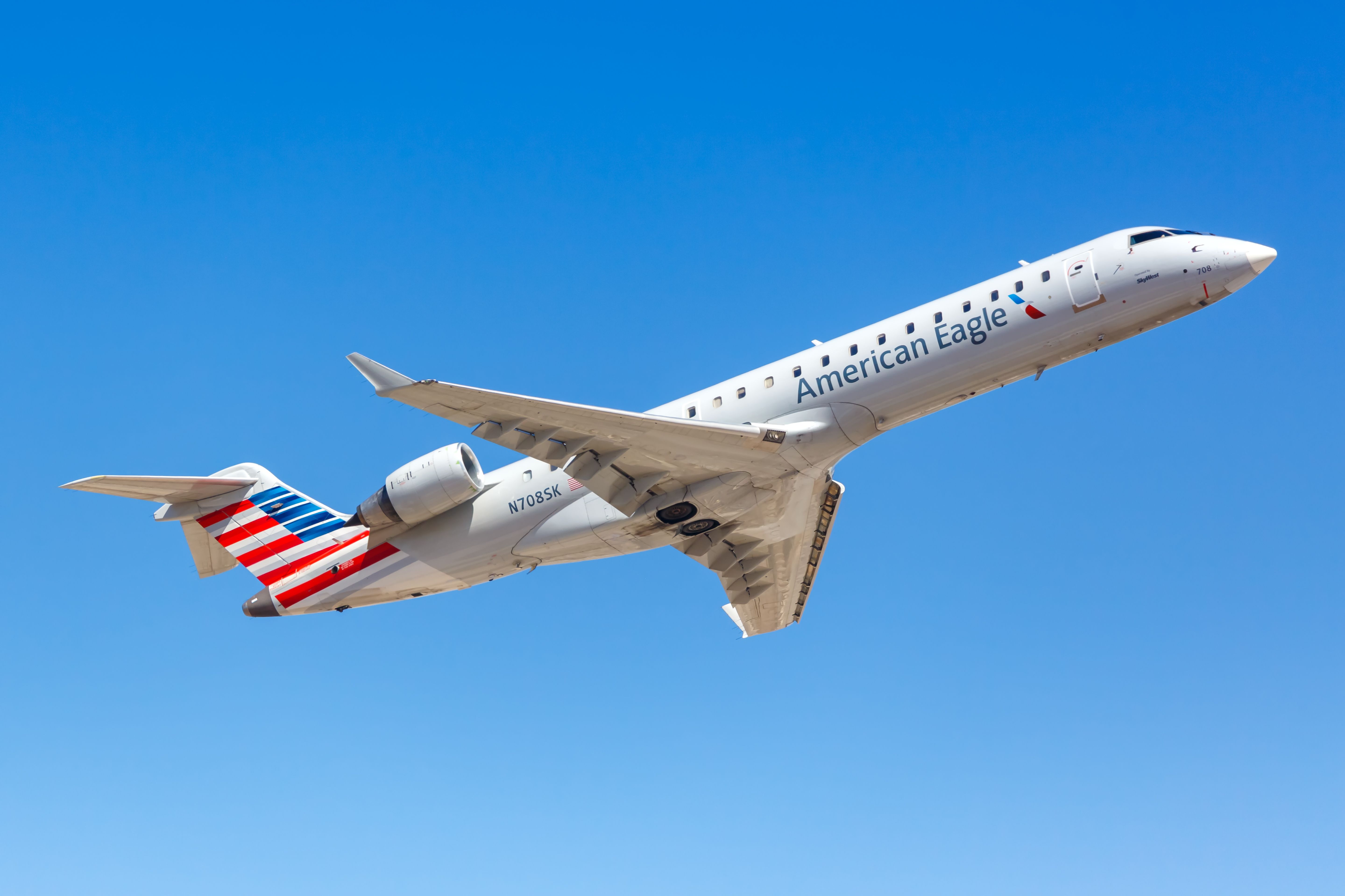 American Airlines Mitsubishi CRJ700 departing PHX shutterstock_1864652653