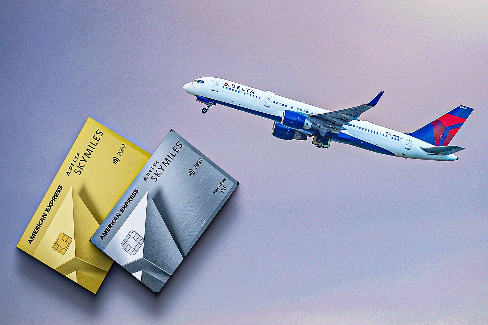 A Delta Air Lines plane with two of the Delta Amex cards