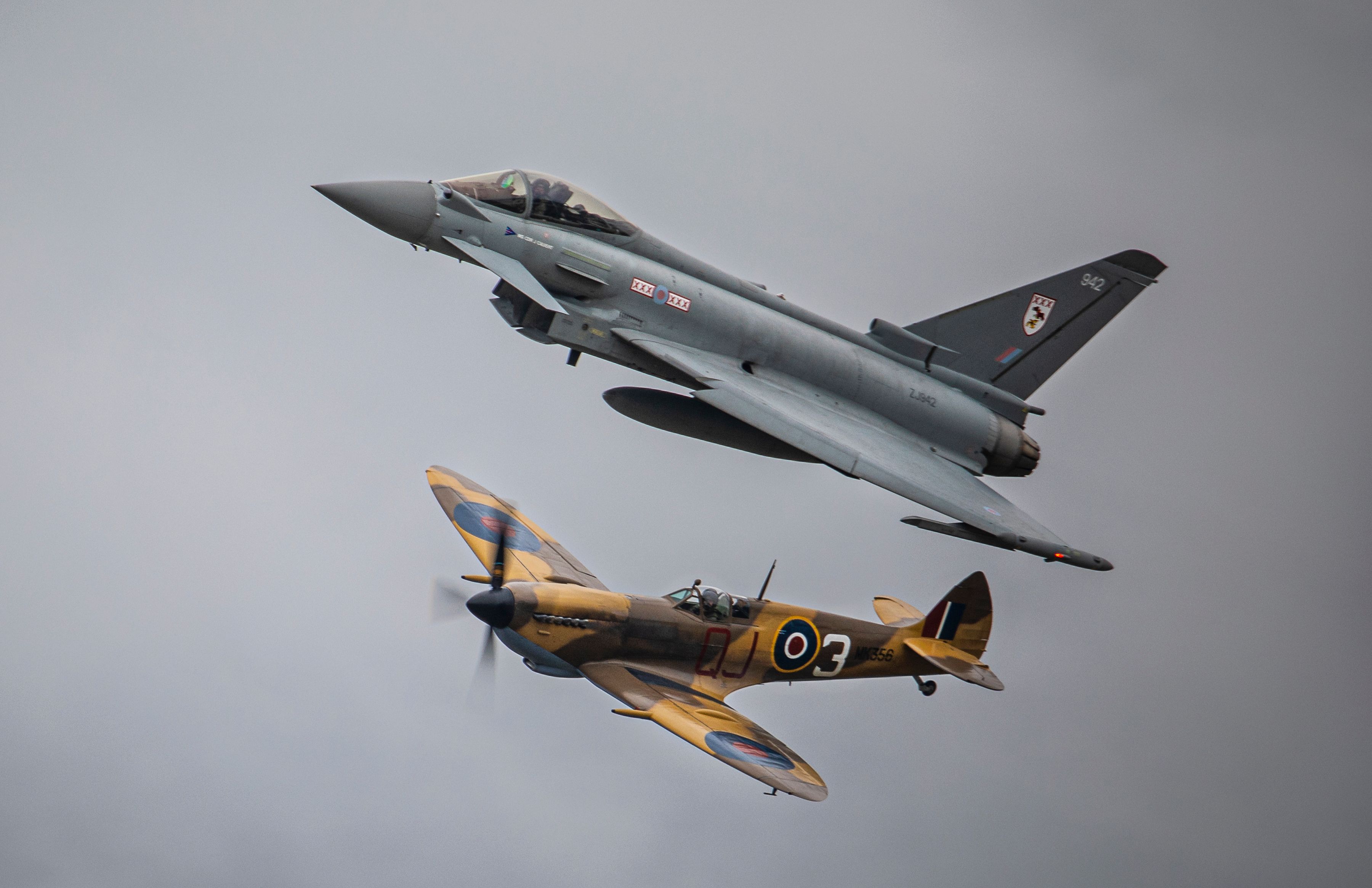 CON-20220520-0443-Typhoon Spitfire Syncro  (2) (2) - A 29 Sqn Typhoon FGR4 flown by the RAF Typhoon Display Team pilot Flight Leiutenant (Paddy) O’Hare and the Battle of Britain Memorial Flight Spitfire perform in a unique syncro pair formation. The Typhoon Display and the Spitfire are vastly different in power but manage to stay together in this truly iconic image.Images, SGT Paul Oldfield, 20th May 2022