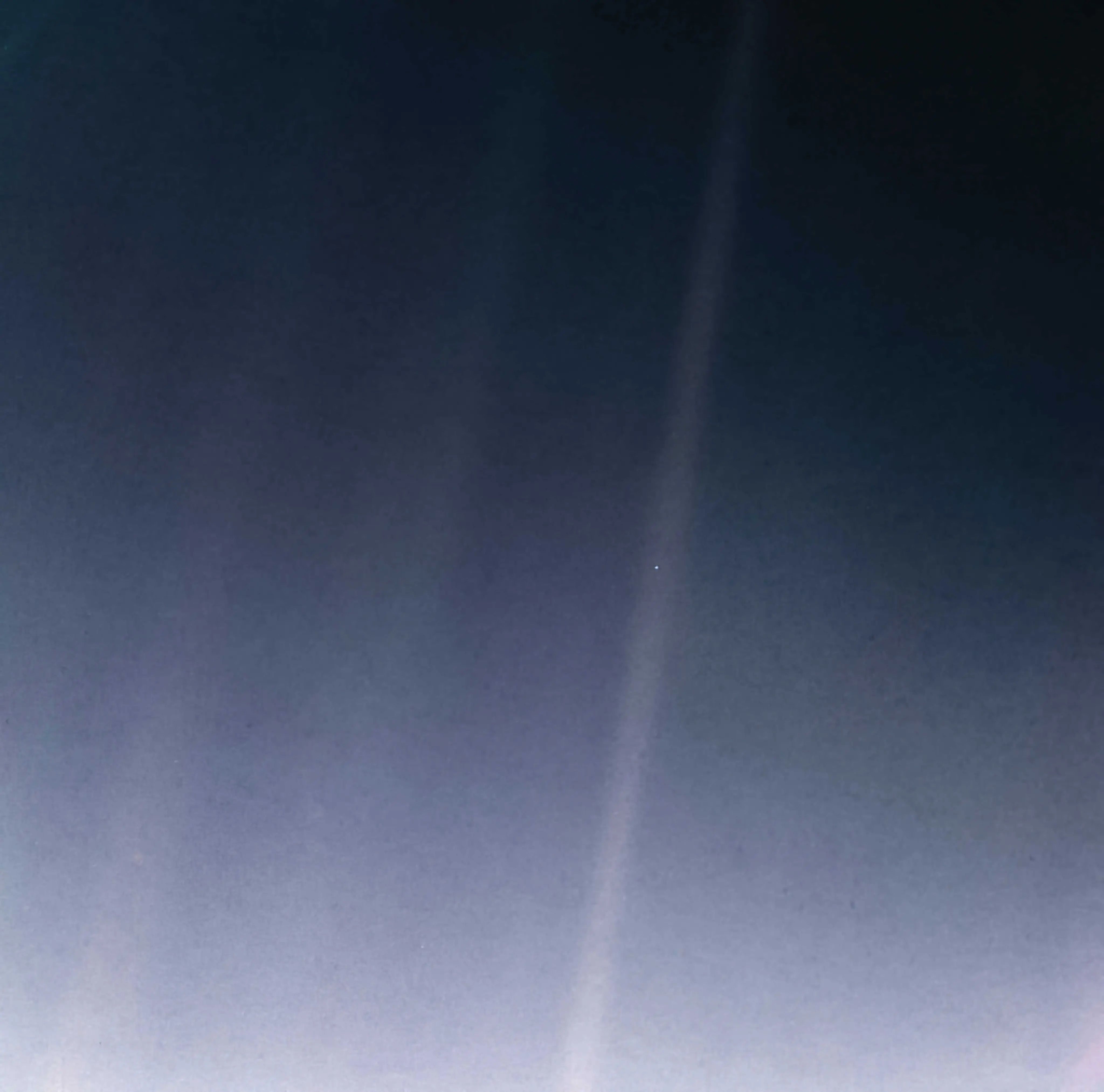 The iconic "pale blue dot," image, depicting Earth, taken by Voyager 1