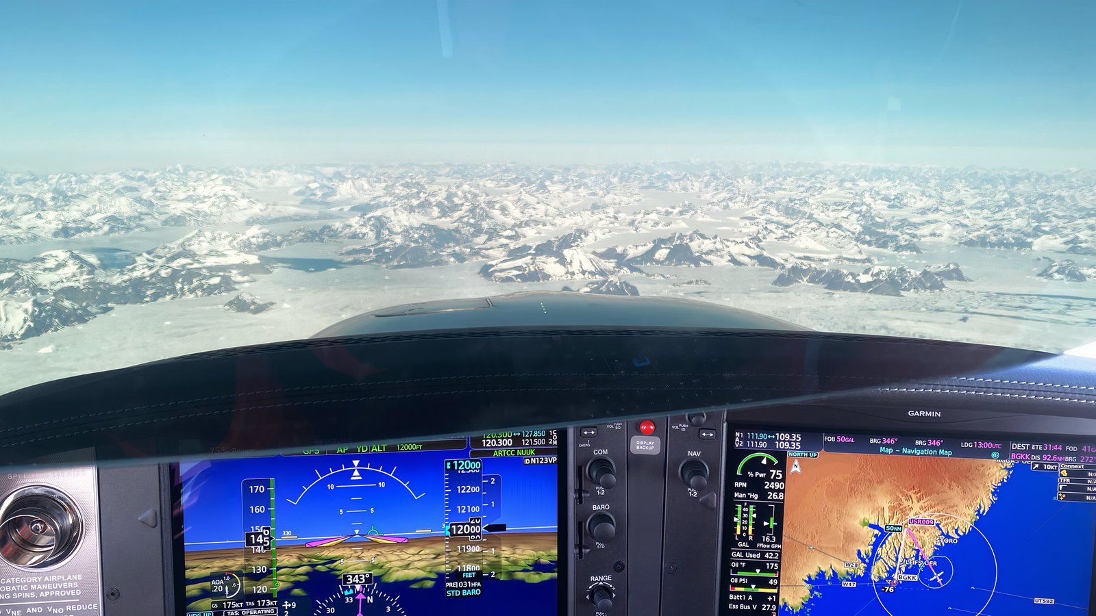 Stef overflying the mountains of Greenland in a Cirrus