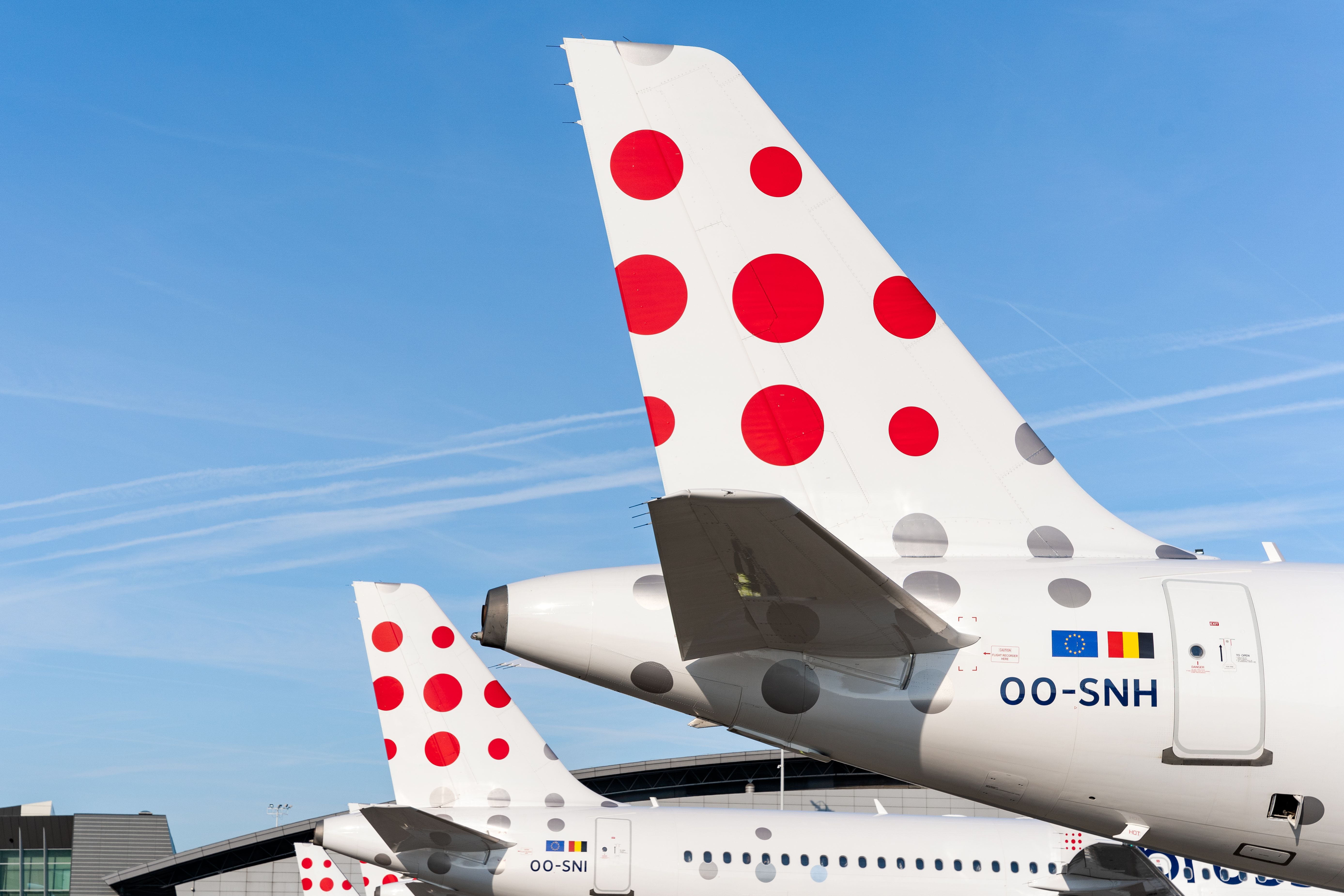 Brussels Airlines A319s and A320s lined up at the gate