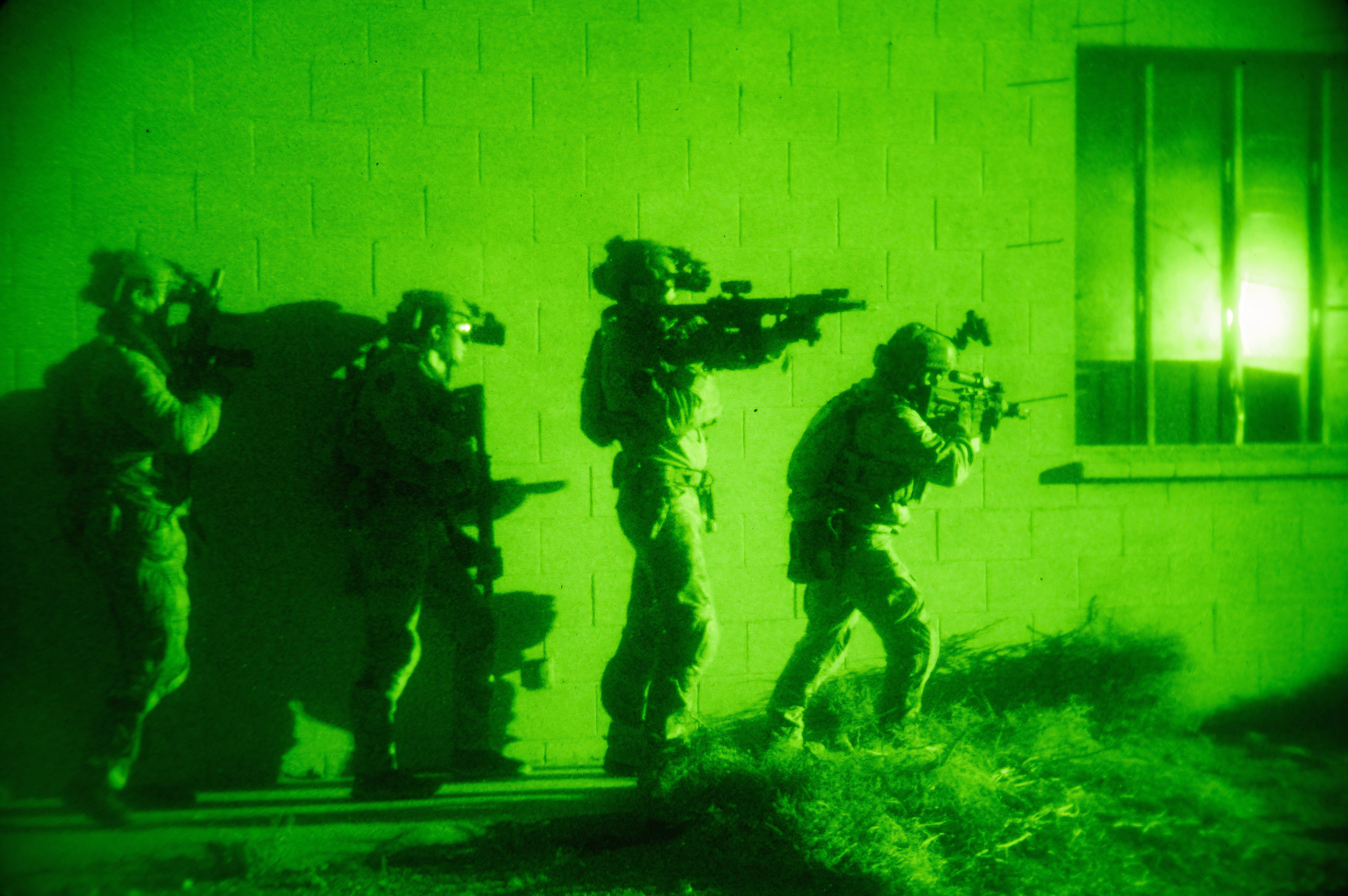 Navy Seals conduct night operation.