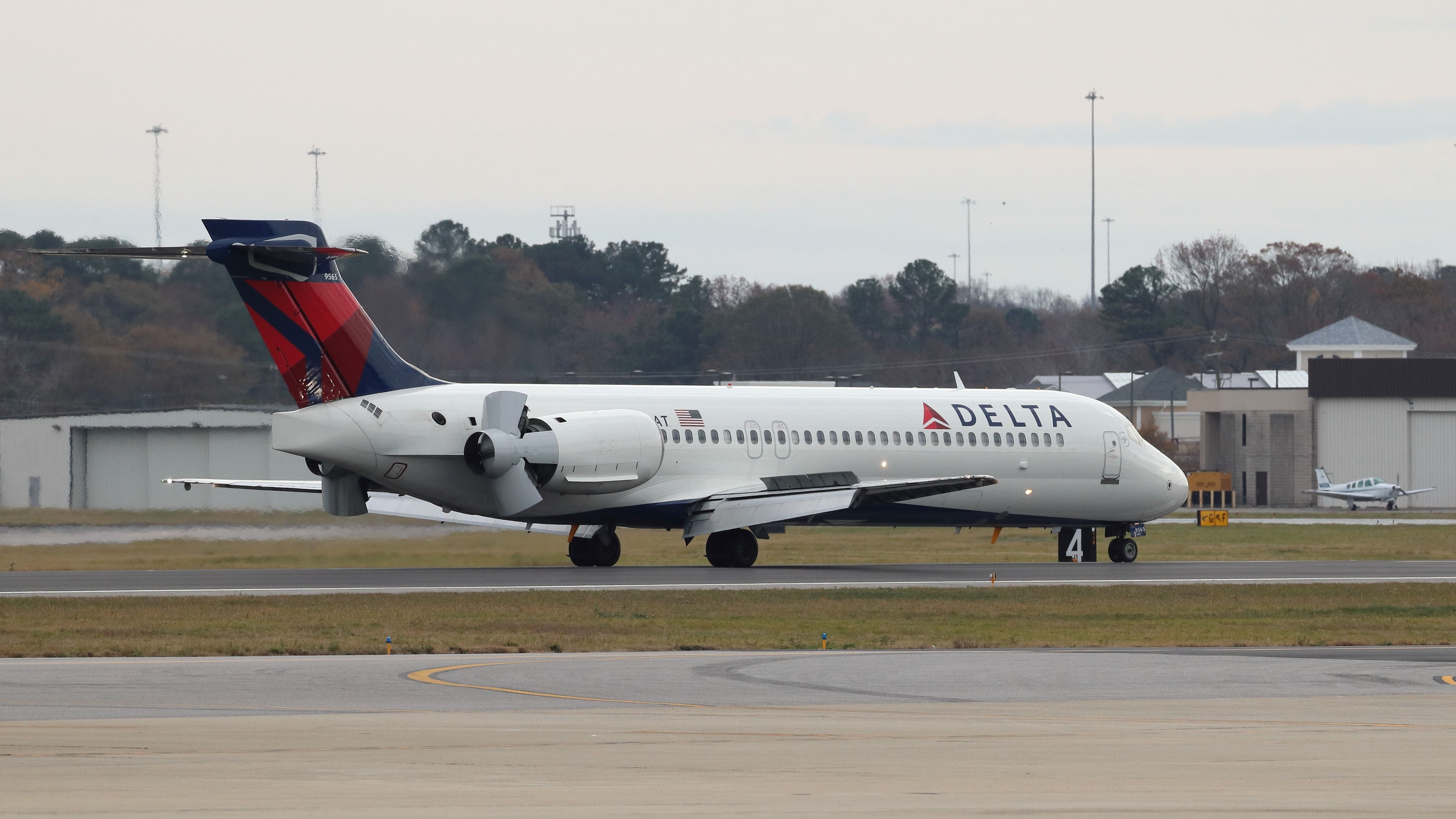 Delta Air Lines Boeing 717-200 slowing down on the runway.