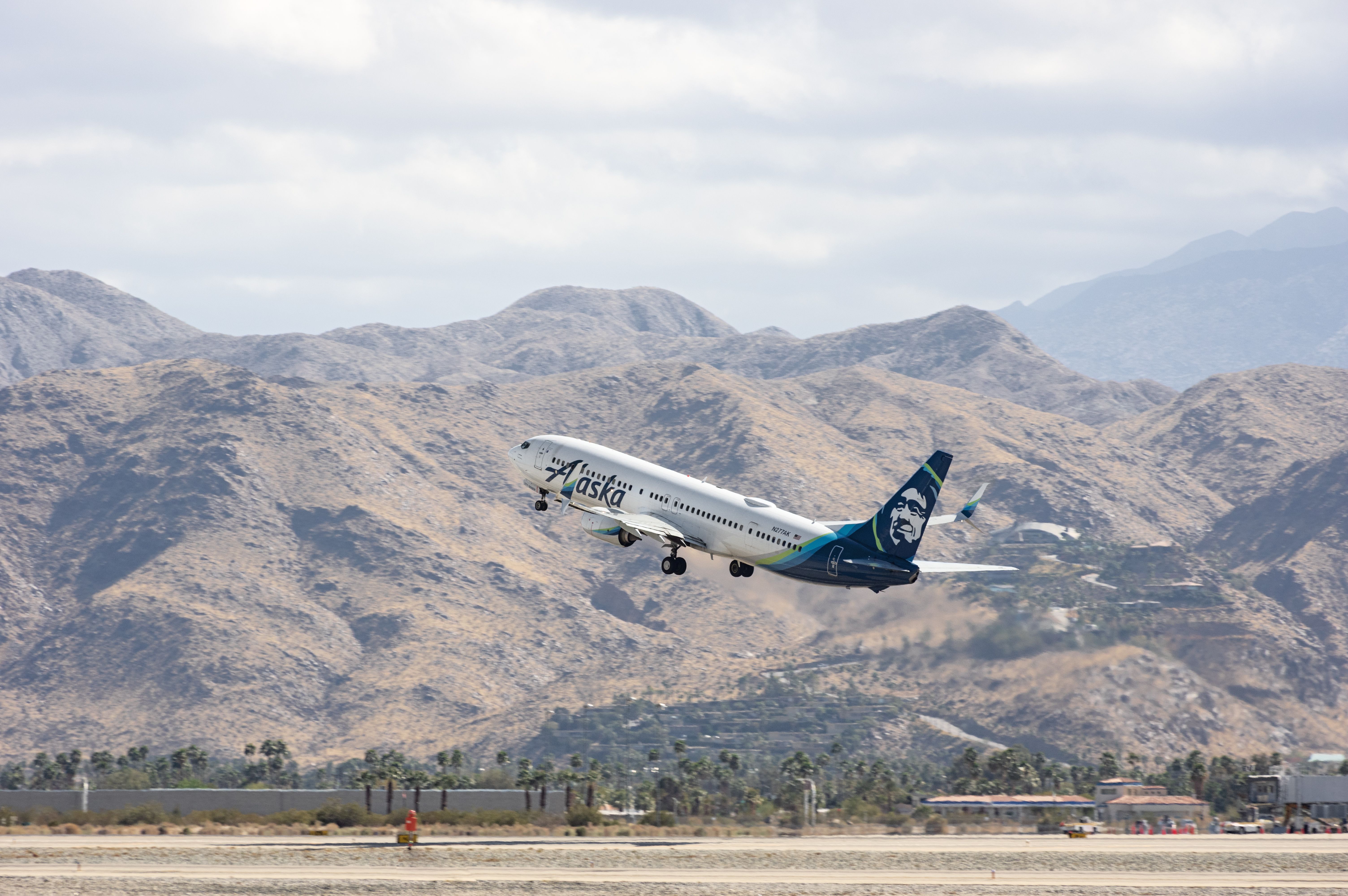 Palm Springs Airport, CA, USA - March 25, 2021: this image shows an Alaska Airlines Boeing 737 departing from the Palm Springs Airport.