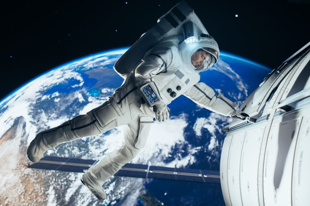 Portrait of a Young Male Astronaut in a Space Suit During a Spacewalk 