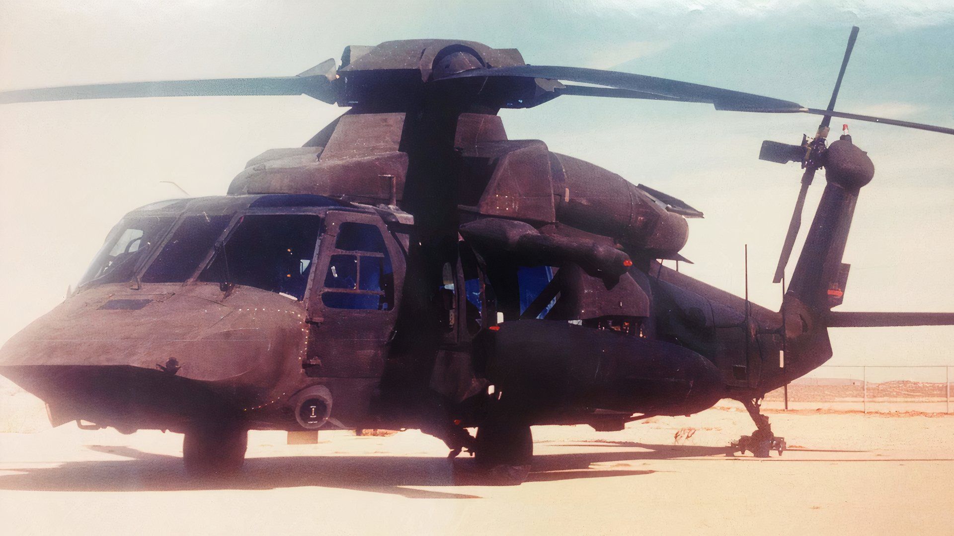 Image of a stealthy Blackhawk with a desert background. 