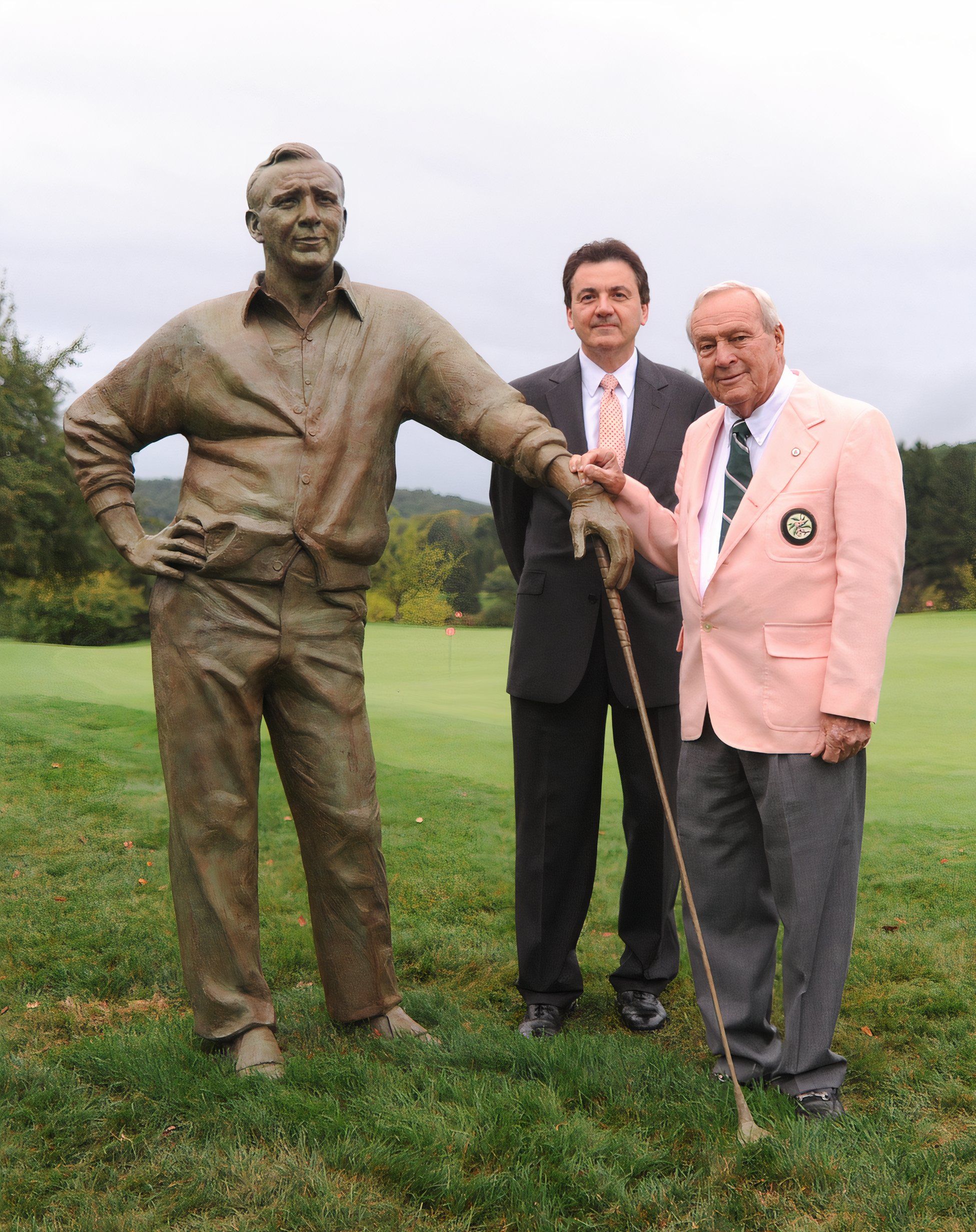 Arnold Palmer with a statue