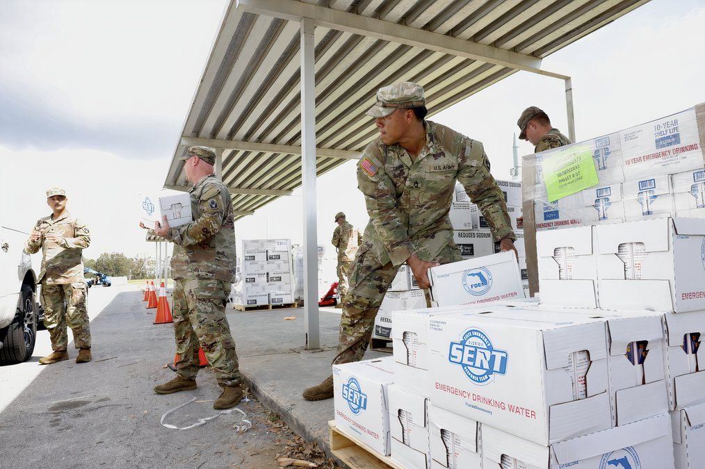 Soldiers moving relief aid.