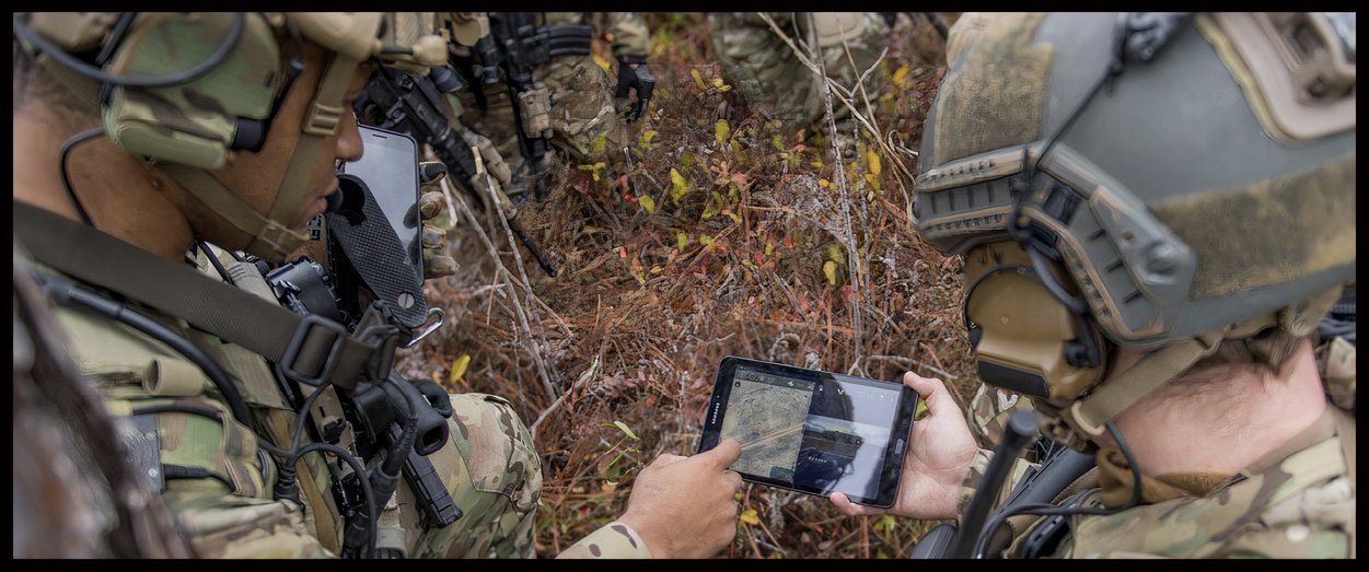 Image of soldiers or airmen using the Tactical Assault Kit in the field