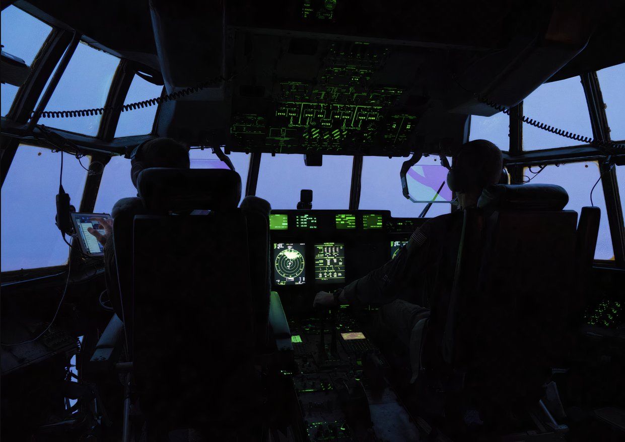 Pilots in a WC-130J flying into a storm