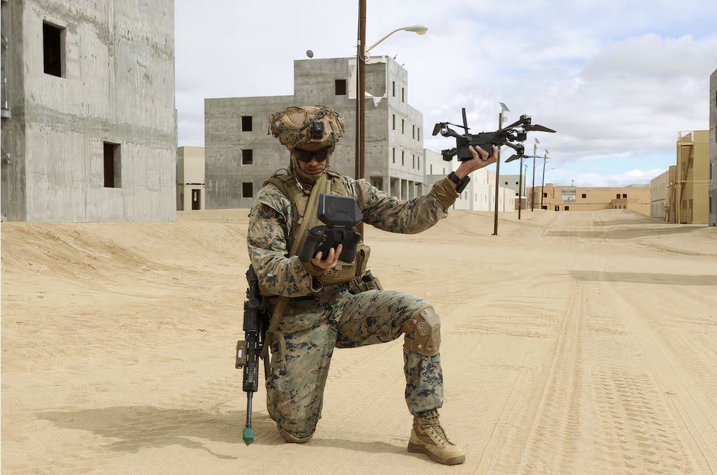 A US Marine uses a drone in a combat exercise