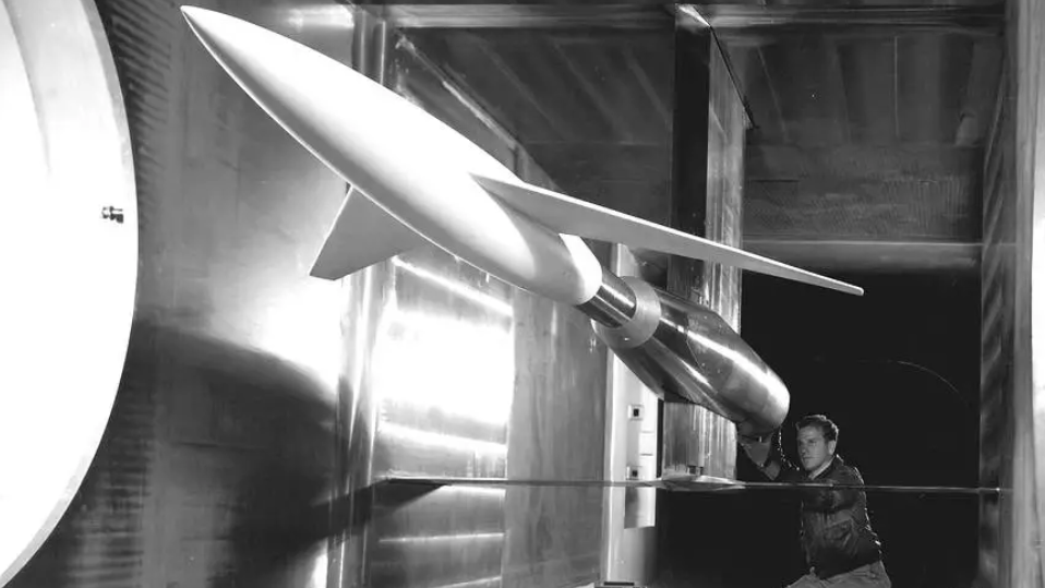 Testing advanced designs for high-speed aircraft in 1948, an engineer makes final calibrations to a model mounted in the 6 x 6 Foot Supersonic Wind Tunnel at the NACA Ames Aeronautical Laboratory,