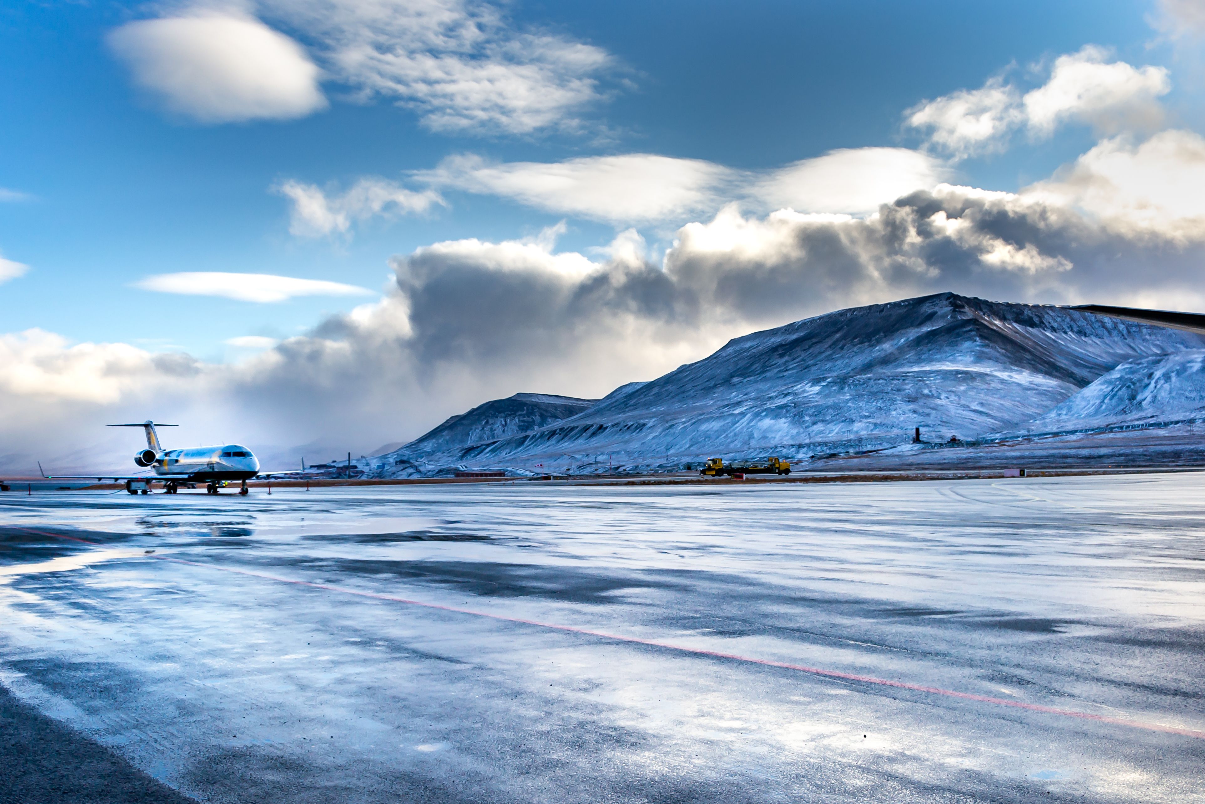 Longyearbyen, Spitsbergen, Norway - September 17, 2014, Arctic airport, airplane is landing on a icy runway