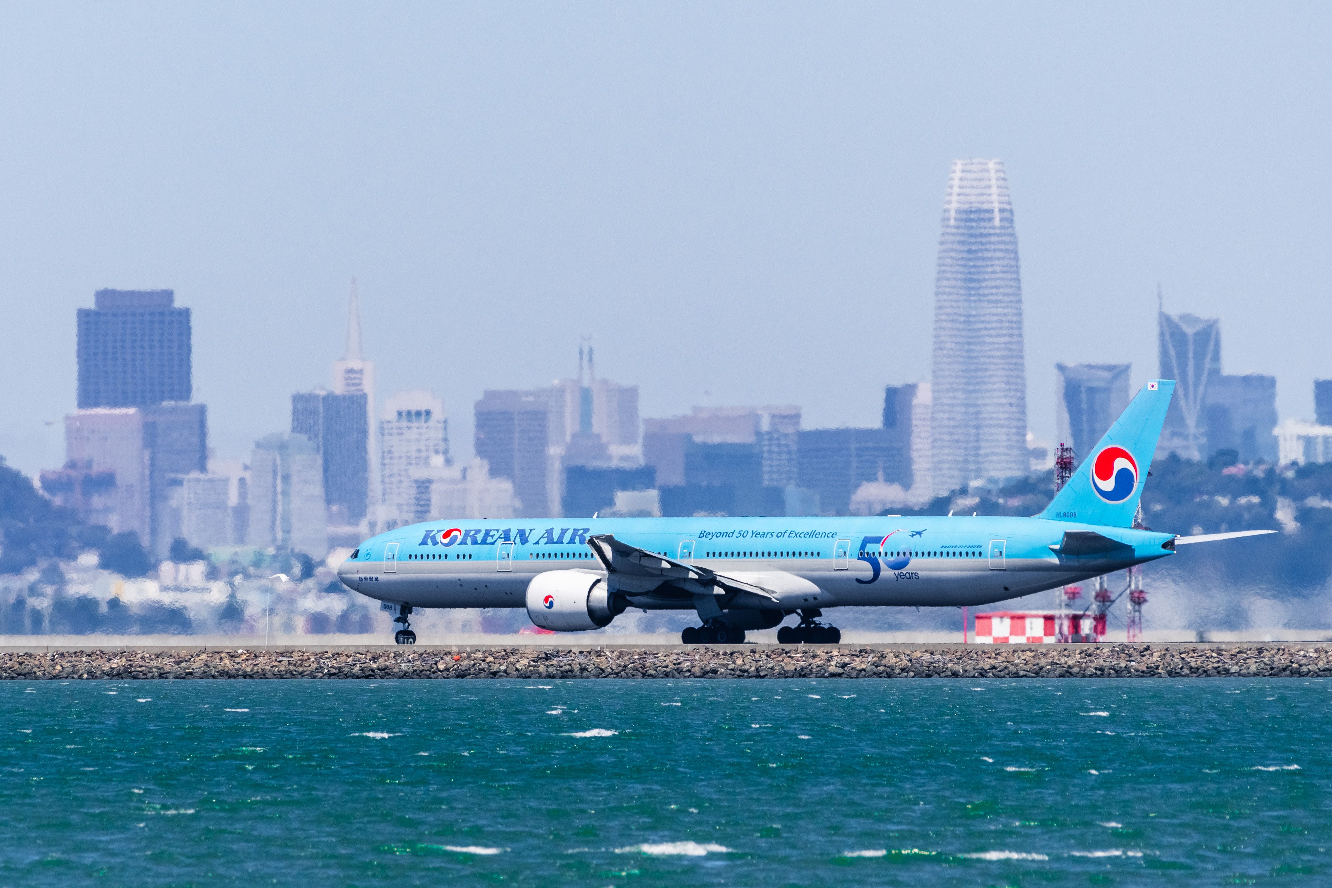 A Korean Air Boeing 777-300ER (HL8008) in the 50th anniversary livery landing at San Francisco International Airport SFO