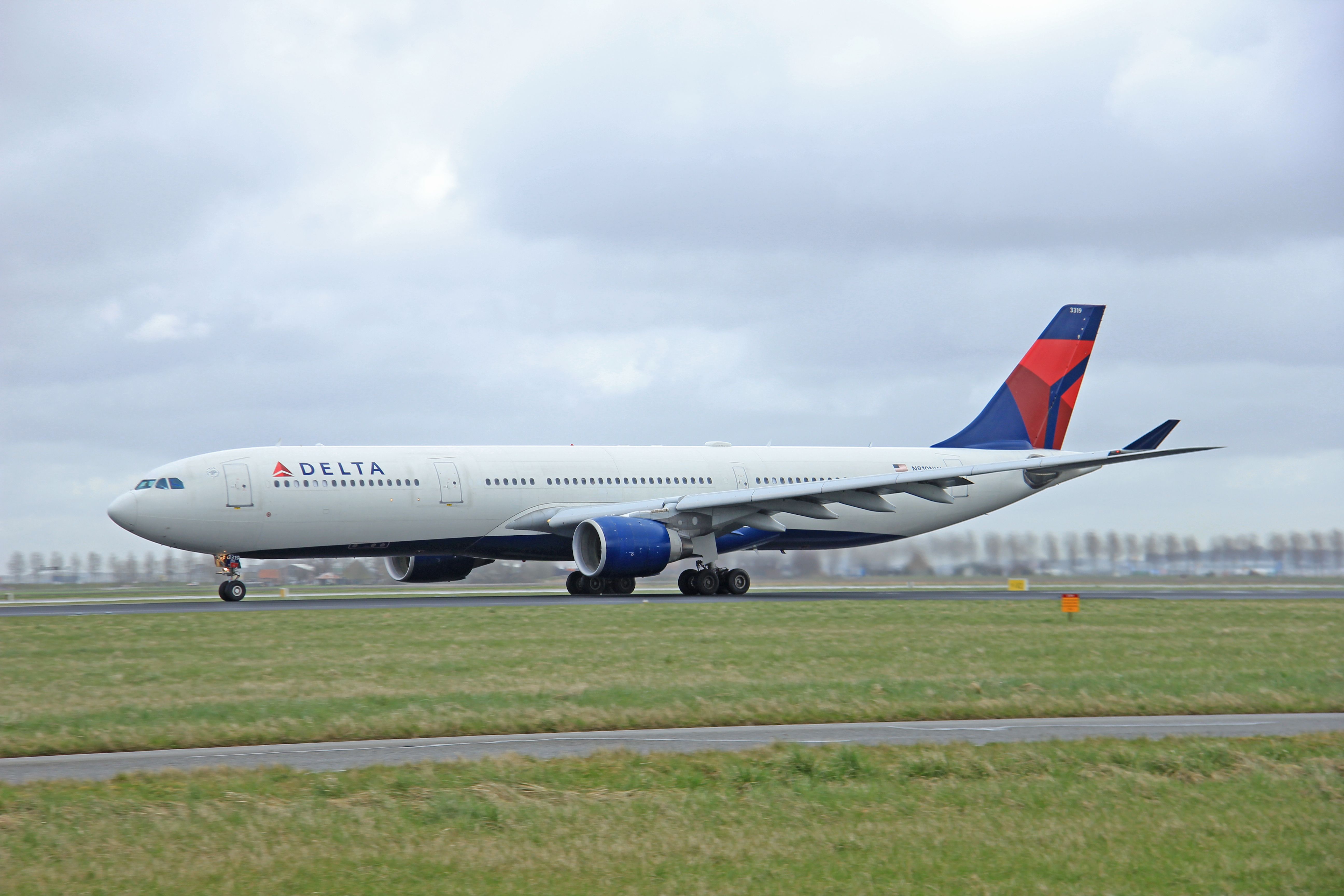 Delta A330 landing on the runway in Amsterdam