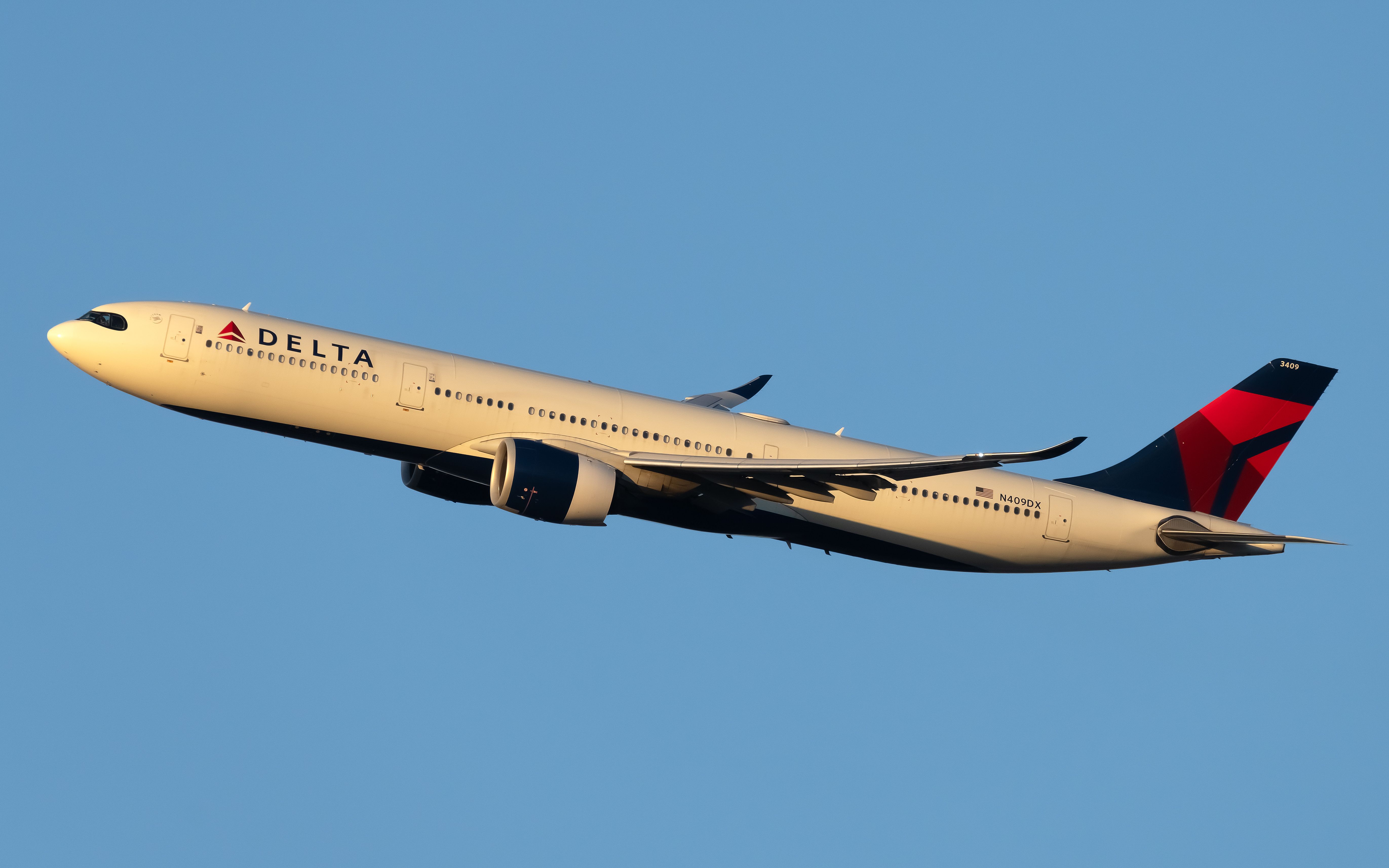 The Delta A330neo takes off at the distance