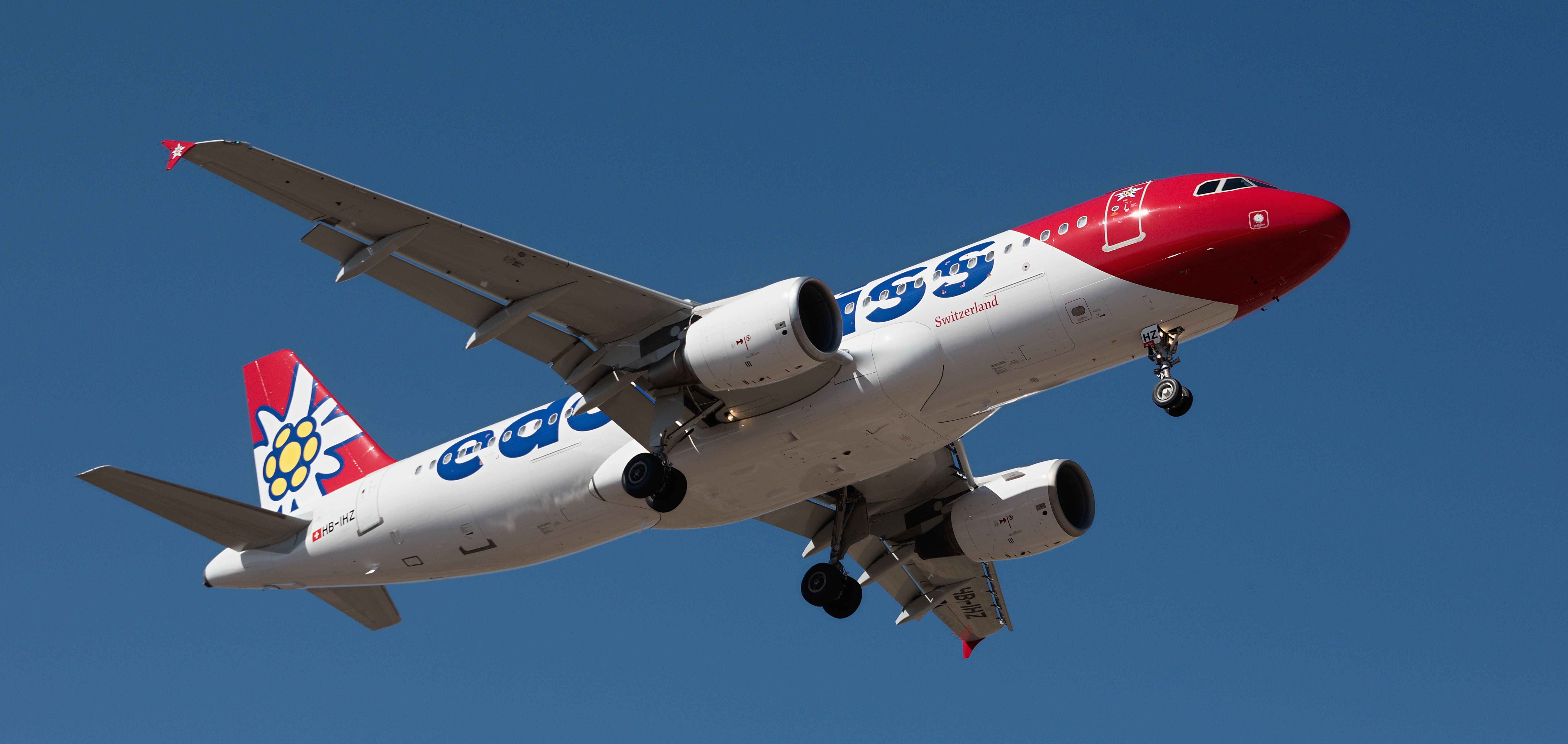 Tenerife, Spain January 31 st, 2024. Airbus A320-214 Edelweiss Air Airlines flies in the blue sky. Landing at Tenerife Airport