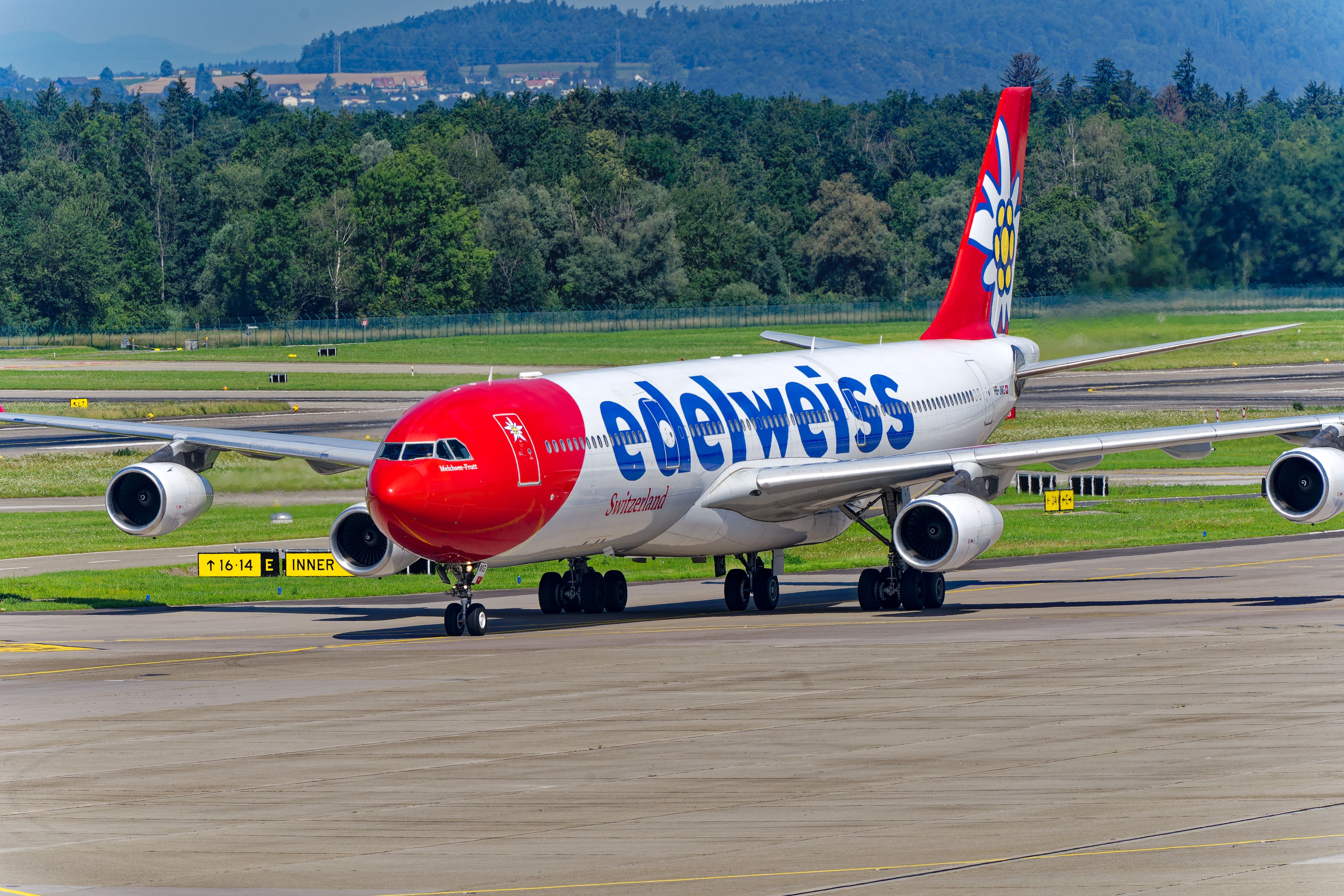 Edelweiss Air Airbus A340-300 HB-JMG airplane taxiing to dock at Swiss airport Zürich Kloten on a sunny summer day. Photo taken July 30th, 2024, Zurich, Switzerland.