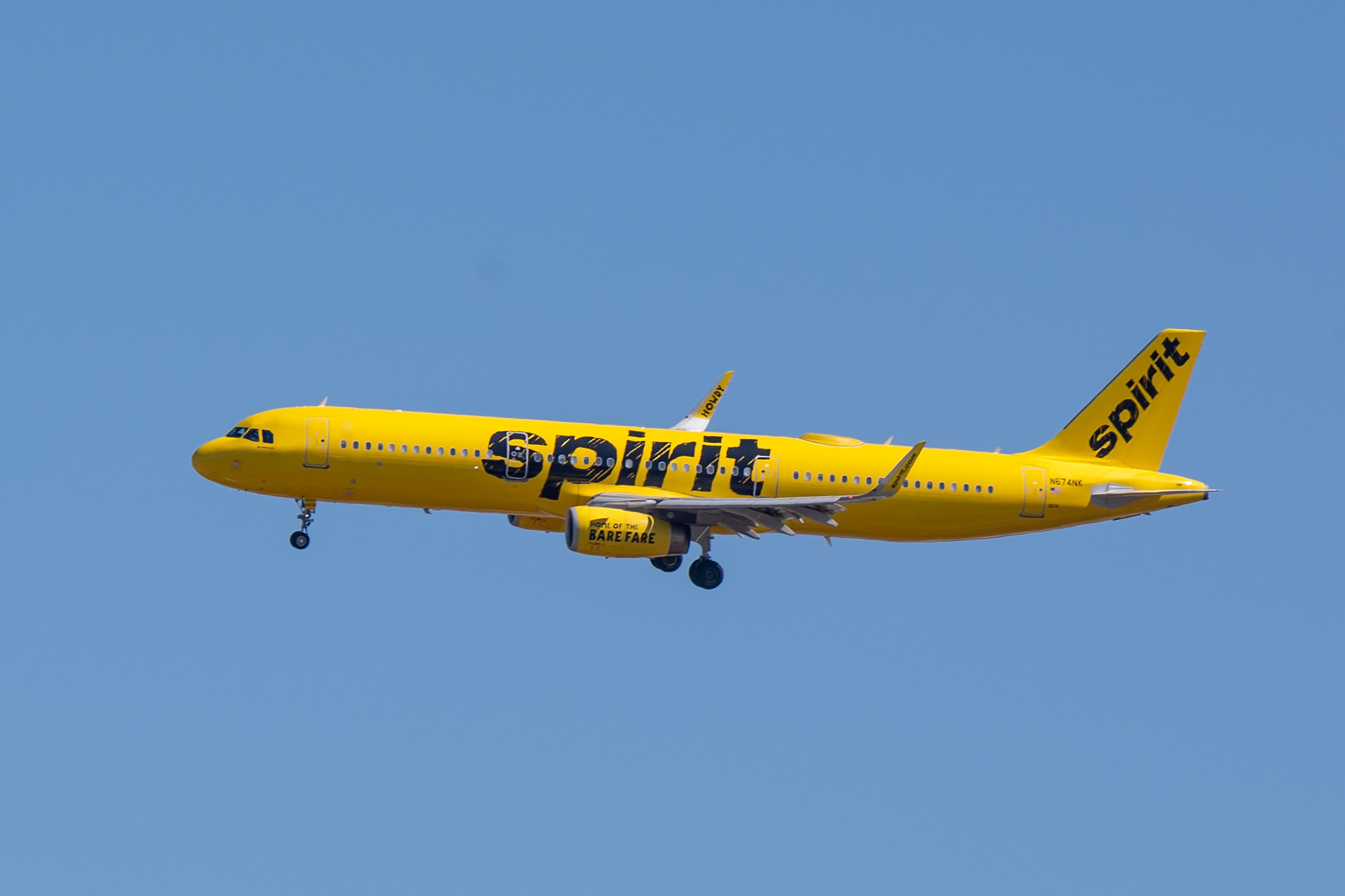 Spirit Airlines Airbus A321 landing at New York LaGuardia Airport LGA shutterstock_1945175962