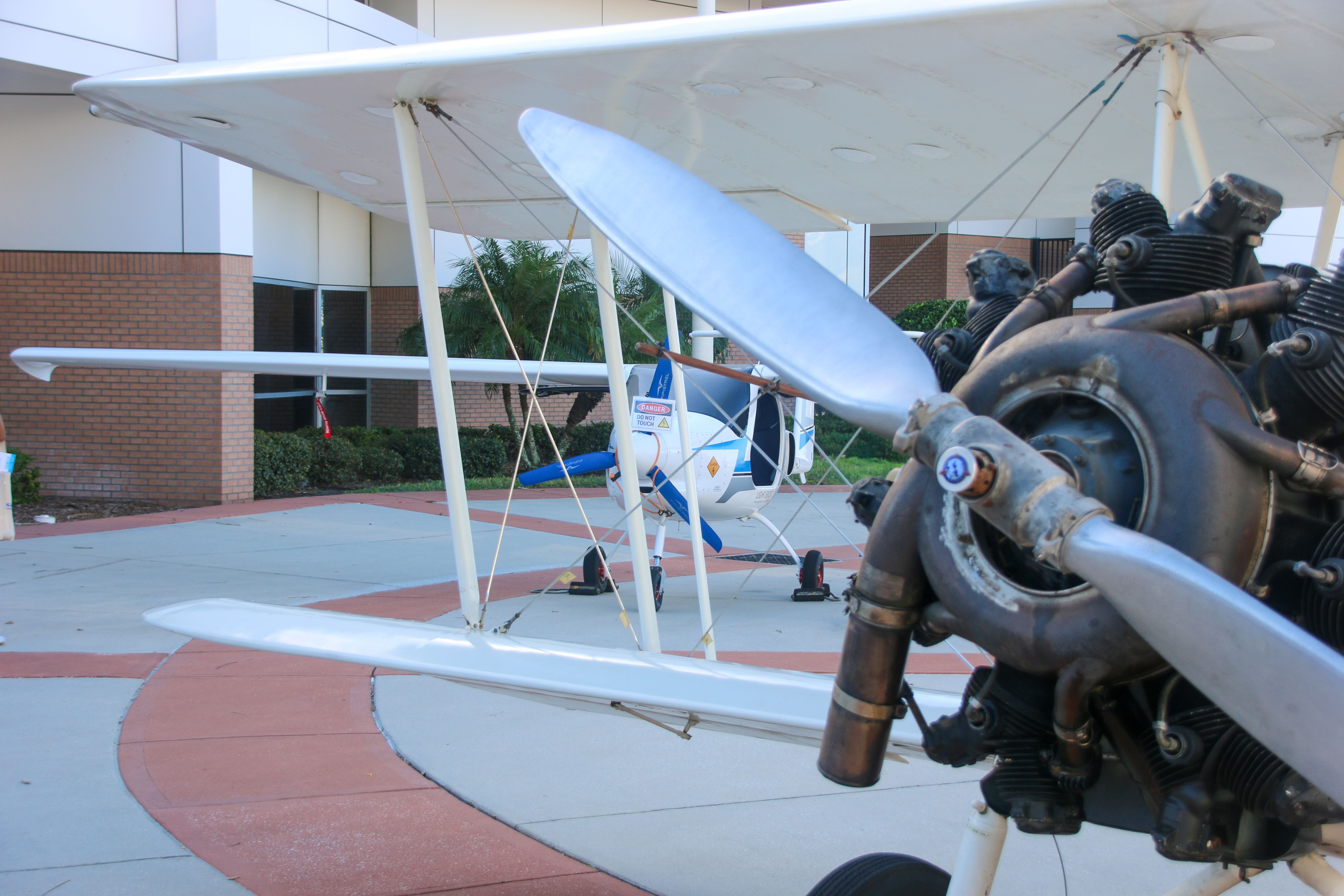 A Velis Electro and a 1928 Waco with a radial piston engine