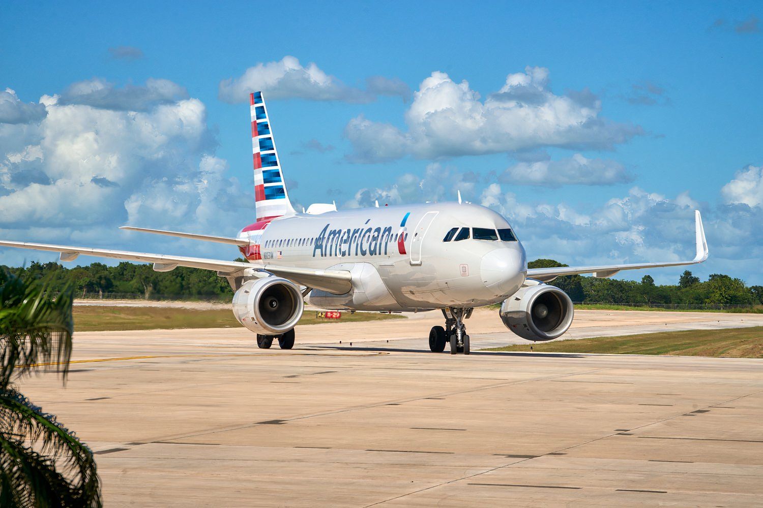 An American Airlines Airbus A319, registered N8031M, lands at La Romana (LRM) in the Dominican Republic