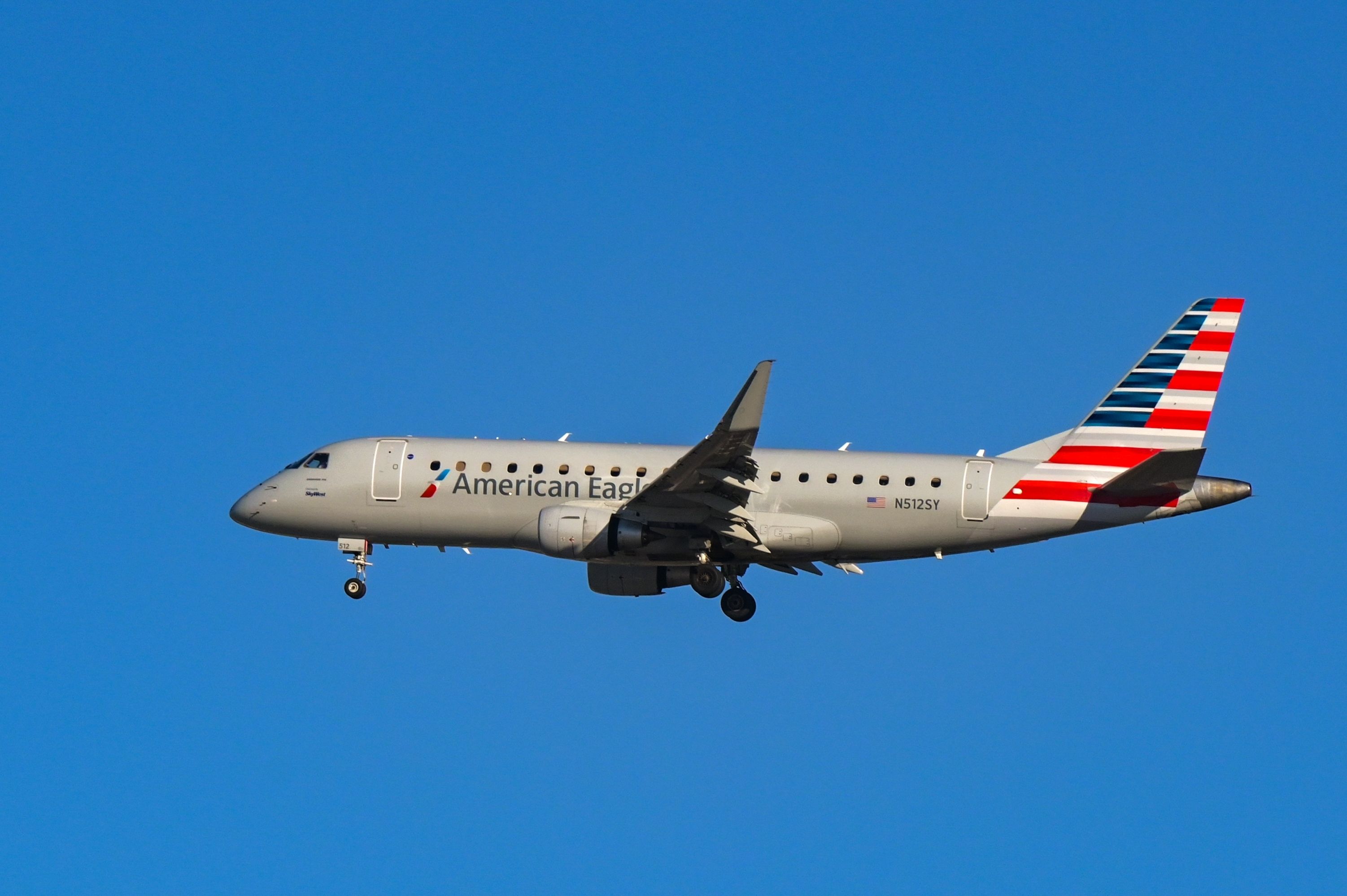 American Eagle Embraer E175 landing at LAX shutterstock_2420494691