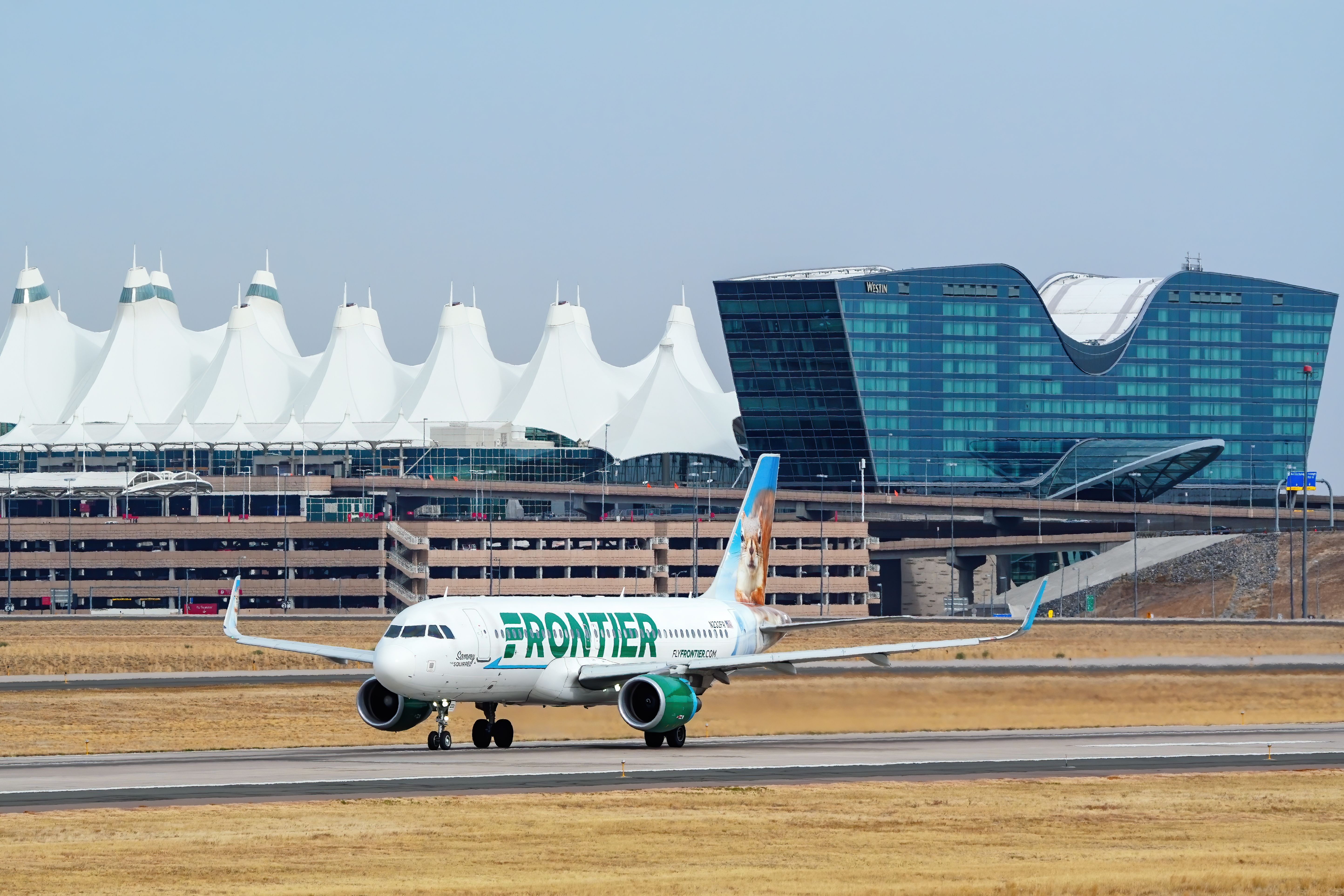 Frontier Airlines Airbus A320neo departing Denver International Airport DEN shutterstock_2106920216