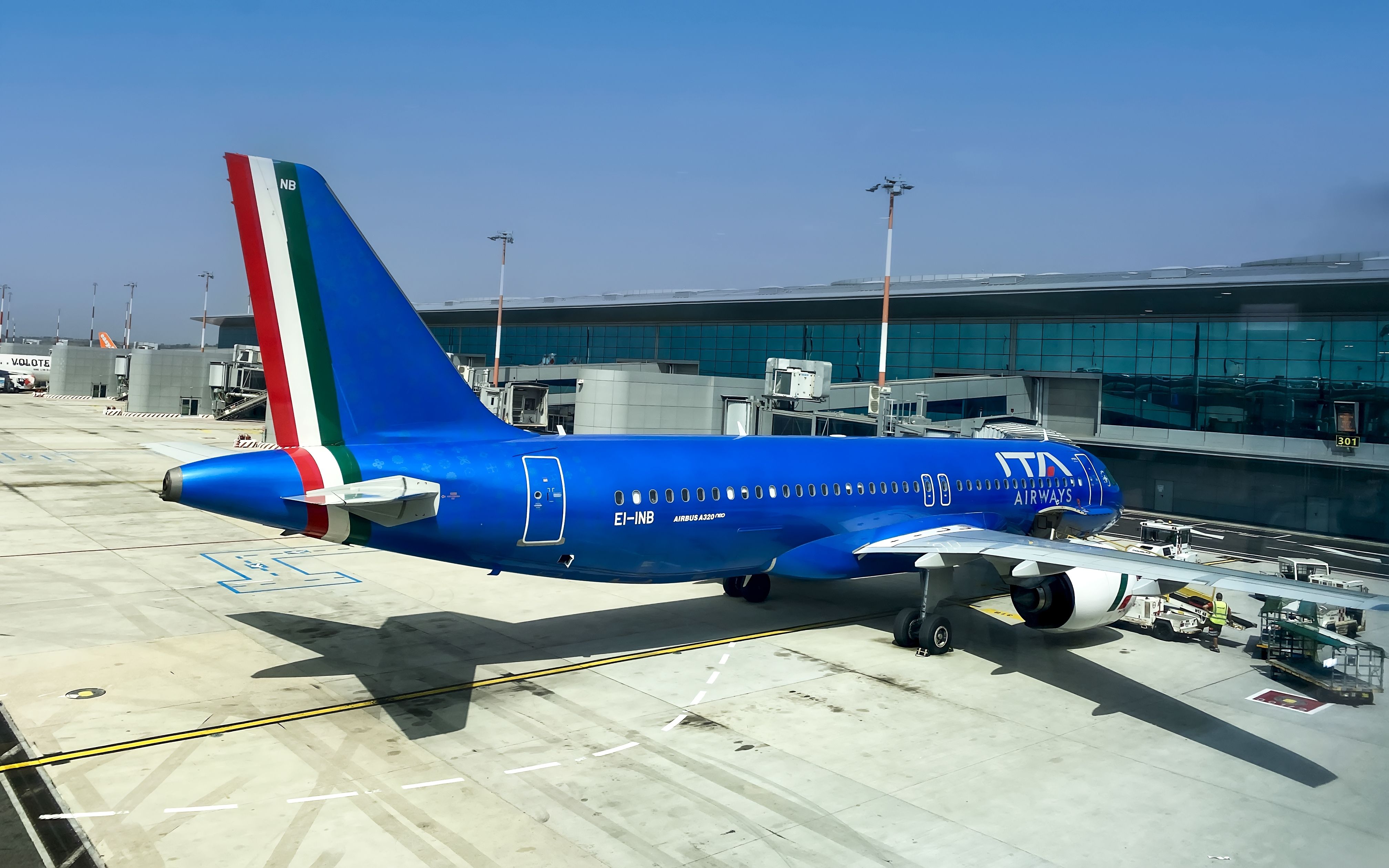 ITA Airways Airbus A320neo is suspended in the gates in FCO Shutterstock_2335520545
