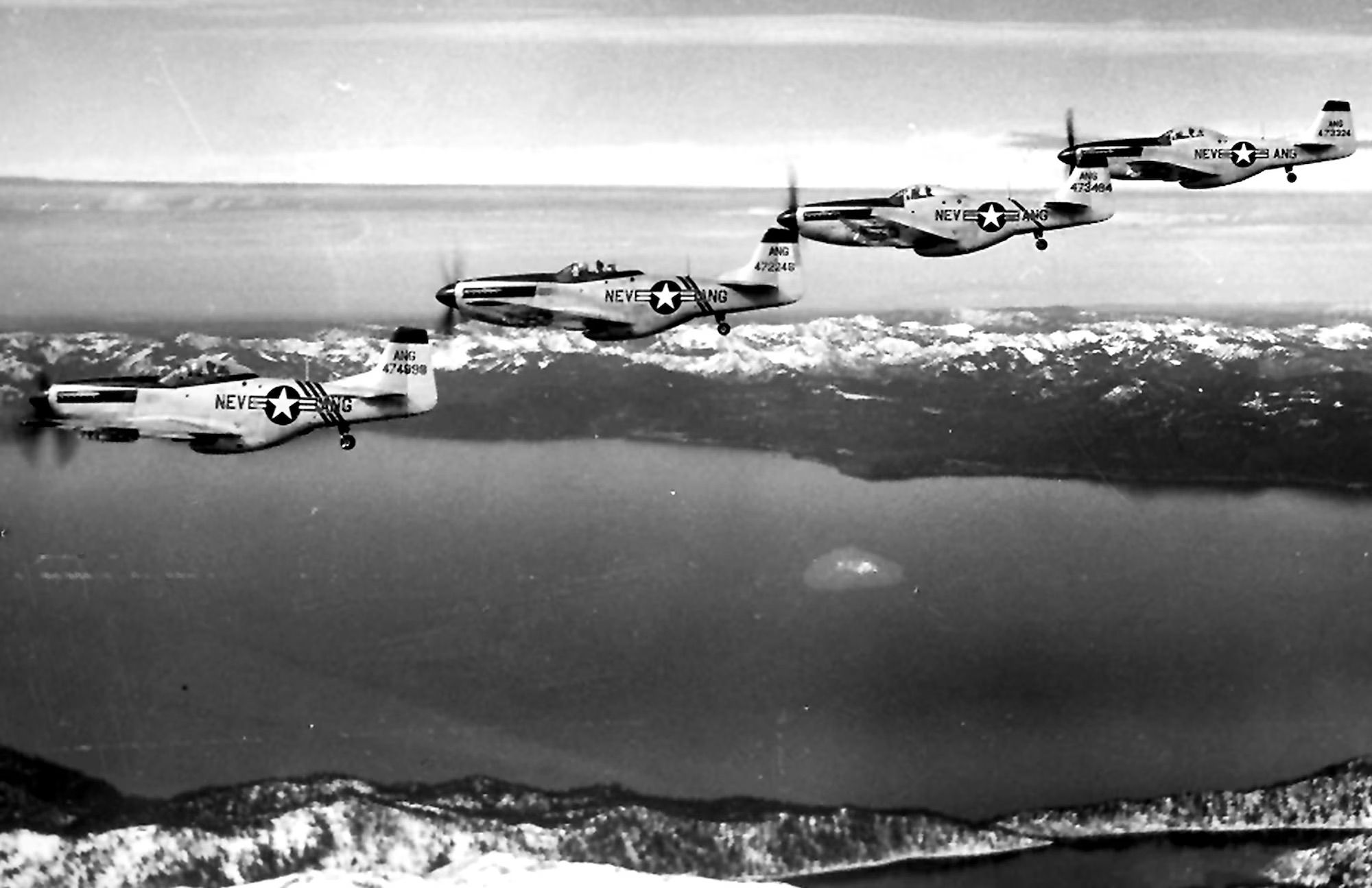 Photo of four P-51s