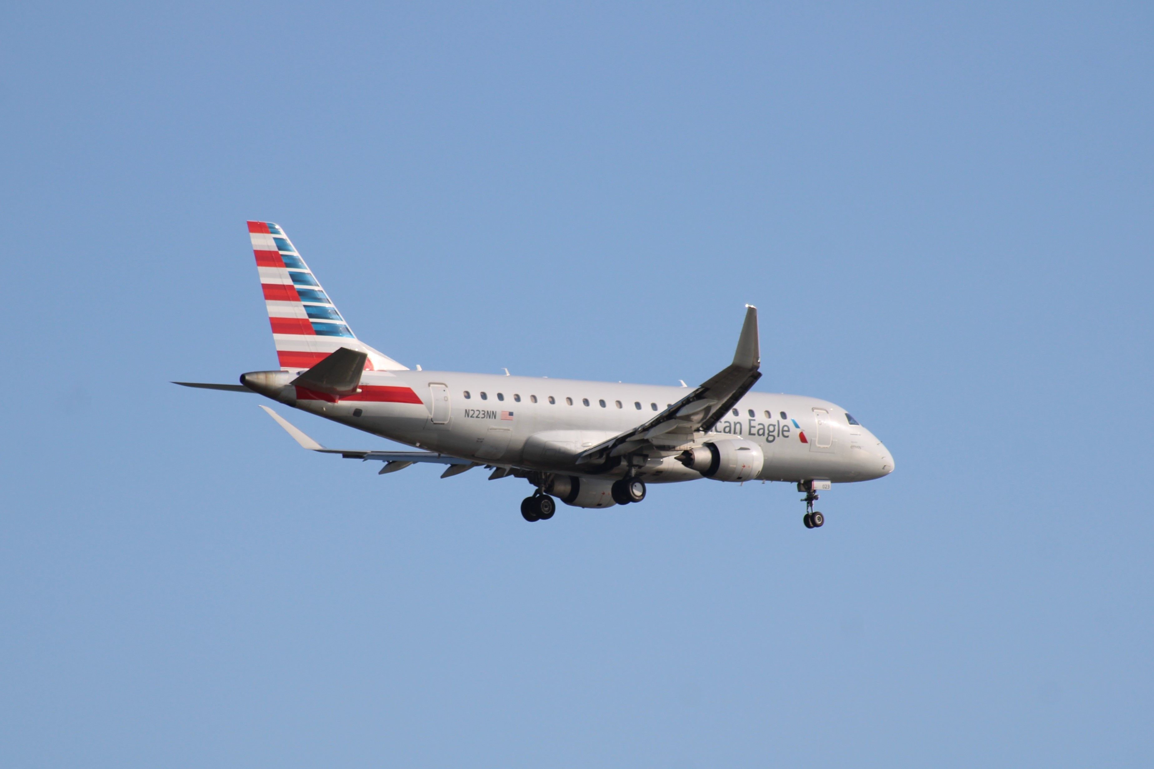 American Eagle (Envoy Air) Embraer E175 N223NN on approach at Boston Logan International Airport.