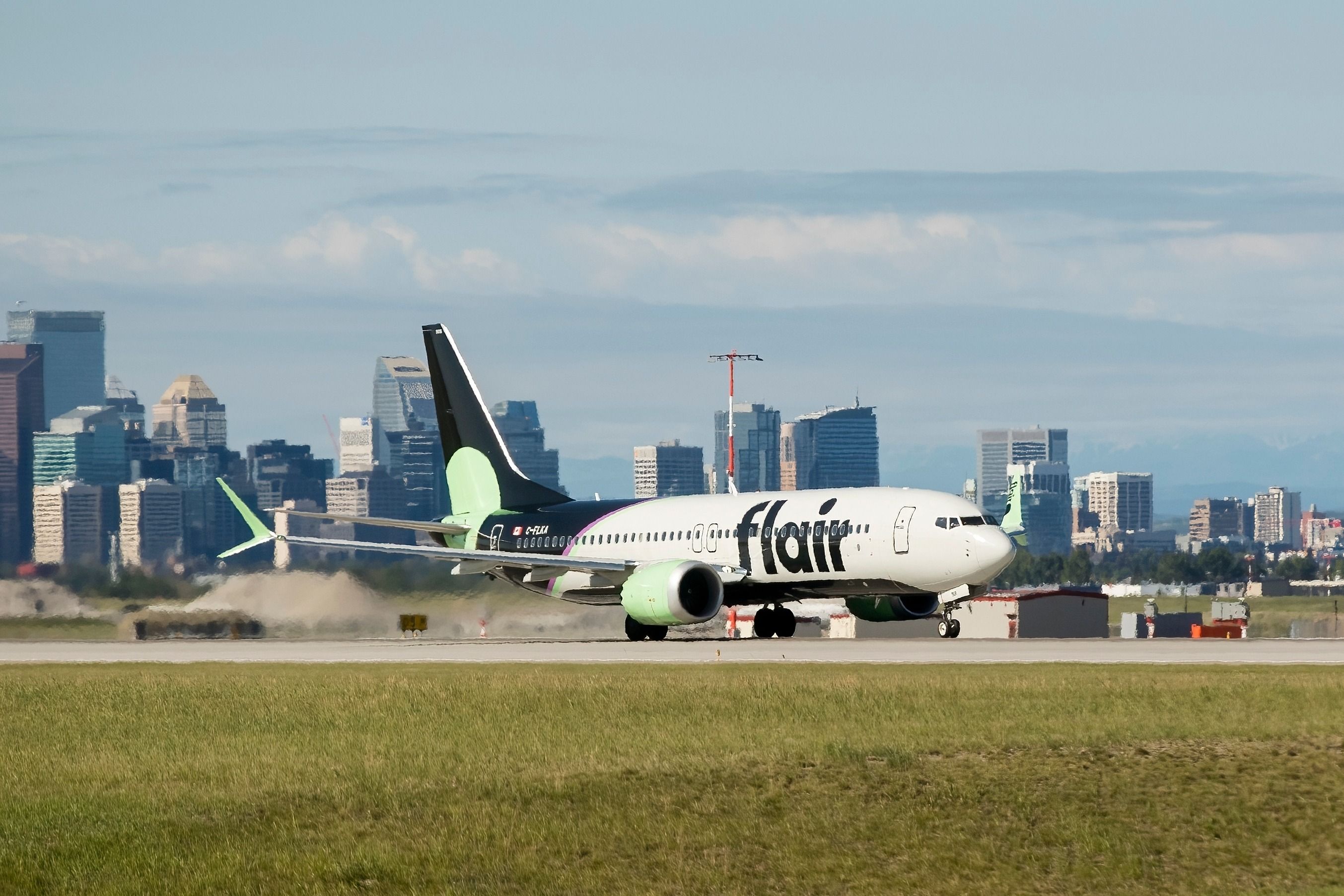 A Flair Airlines Boeing 737 MAX 8, with identification C-FLKA, taking off from Calgary International Airport