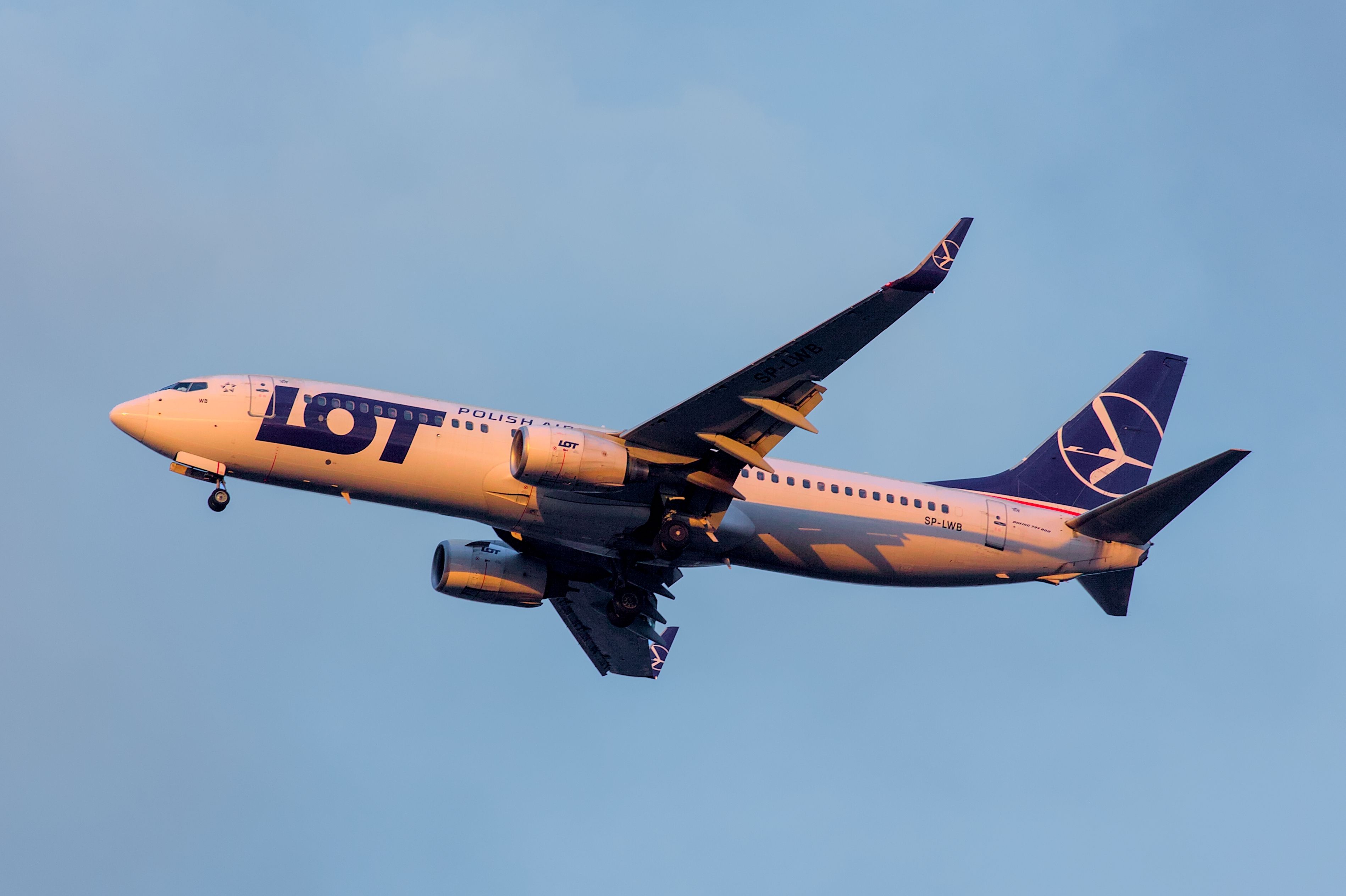 A LOT Polish Airlines Boeing 737 landing during sunset