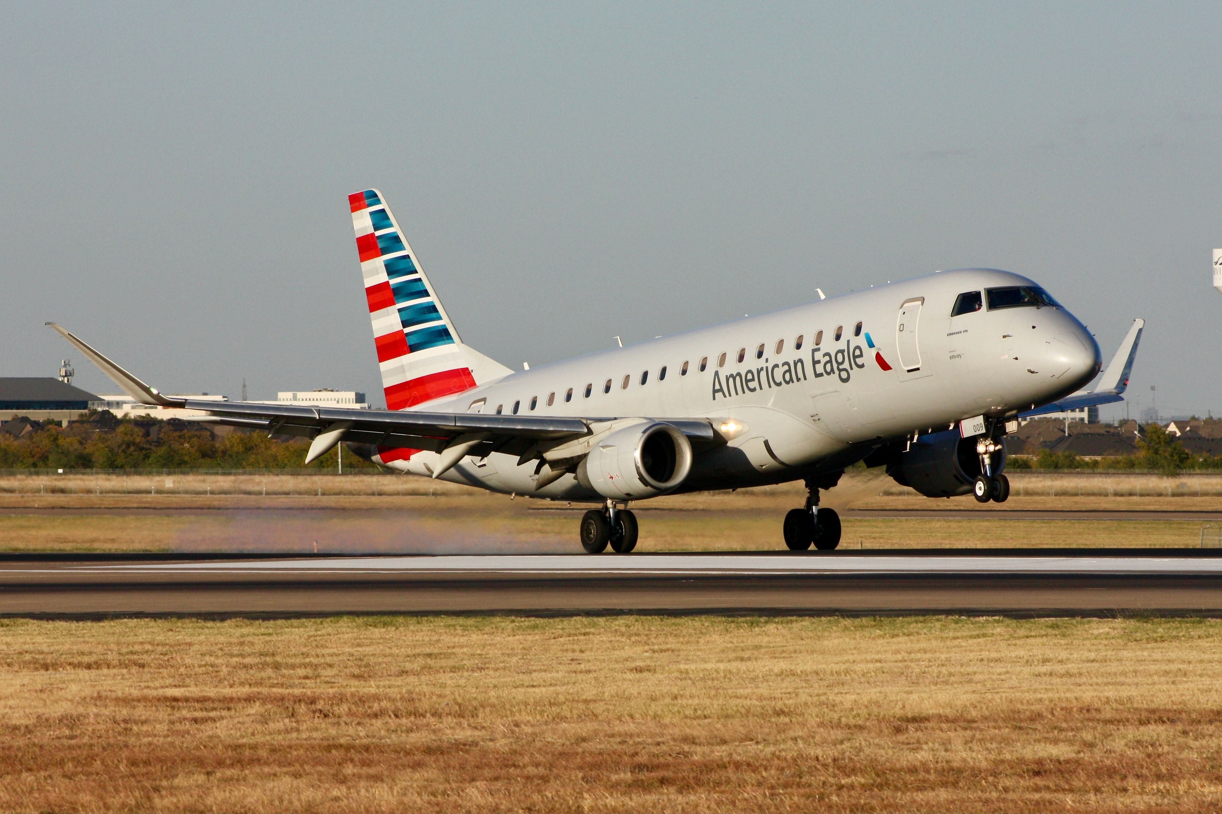 American Eagle (Envoy Air) Embraer E175 landing at Dallas/Fort Worth International Airport.