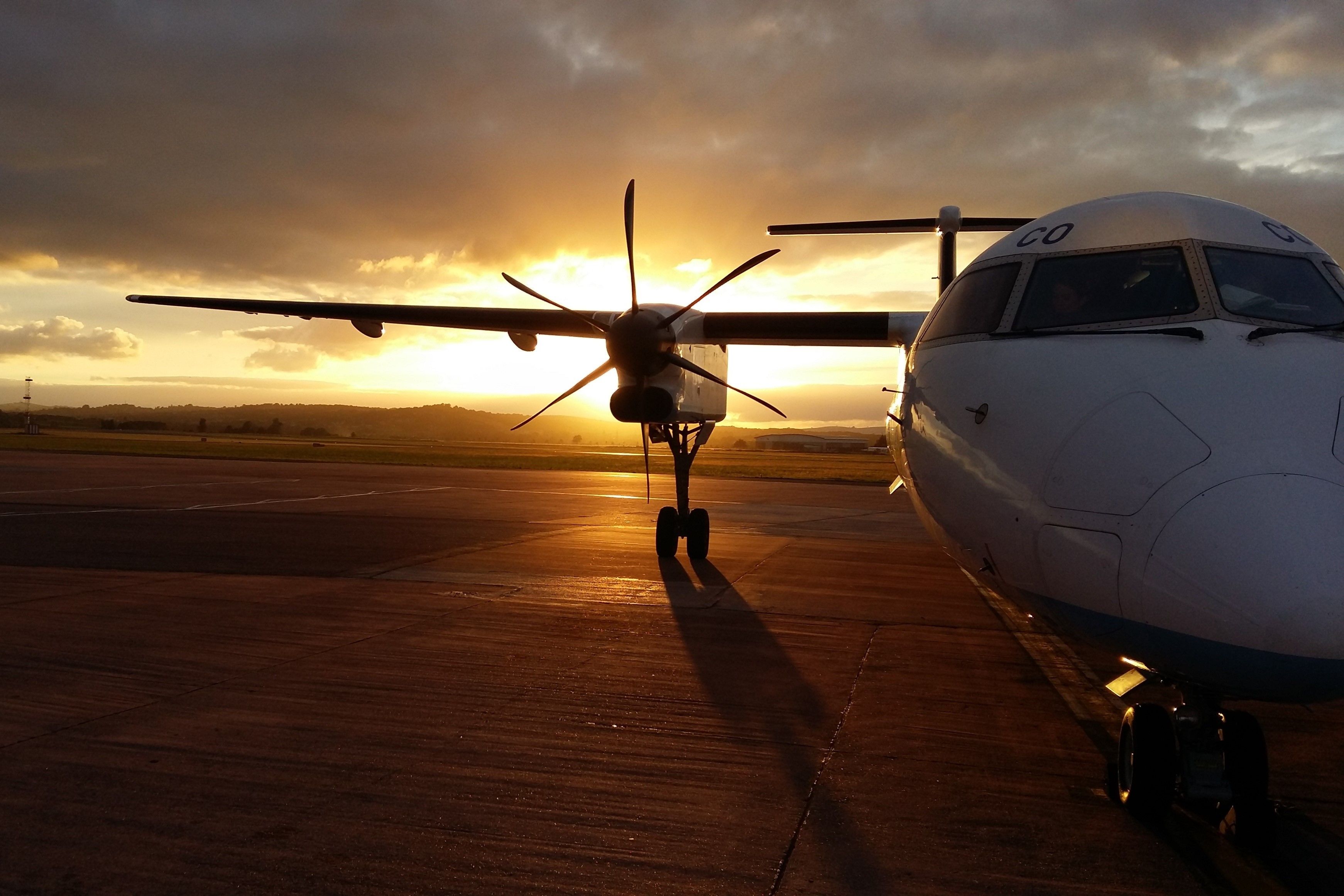 Dash 8 Parked At Sunset