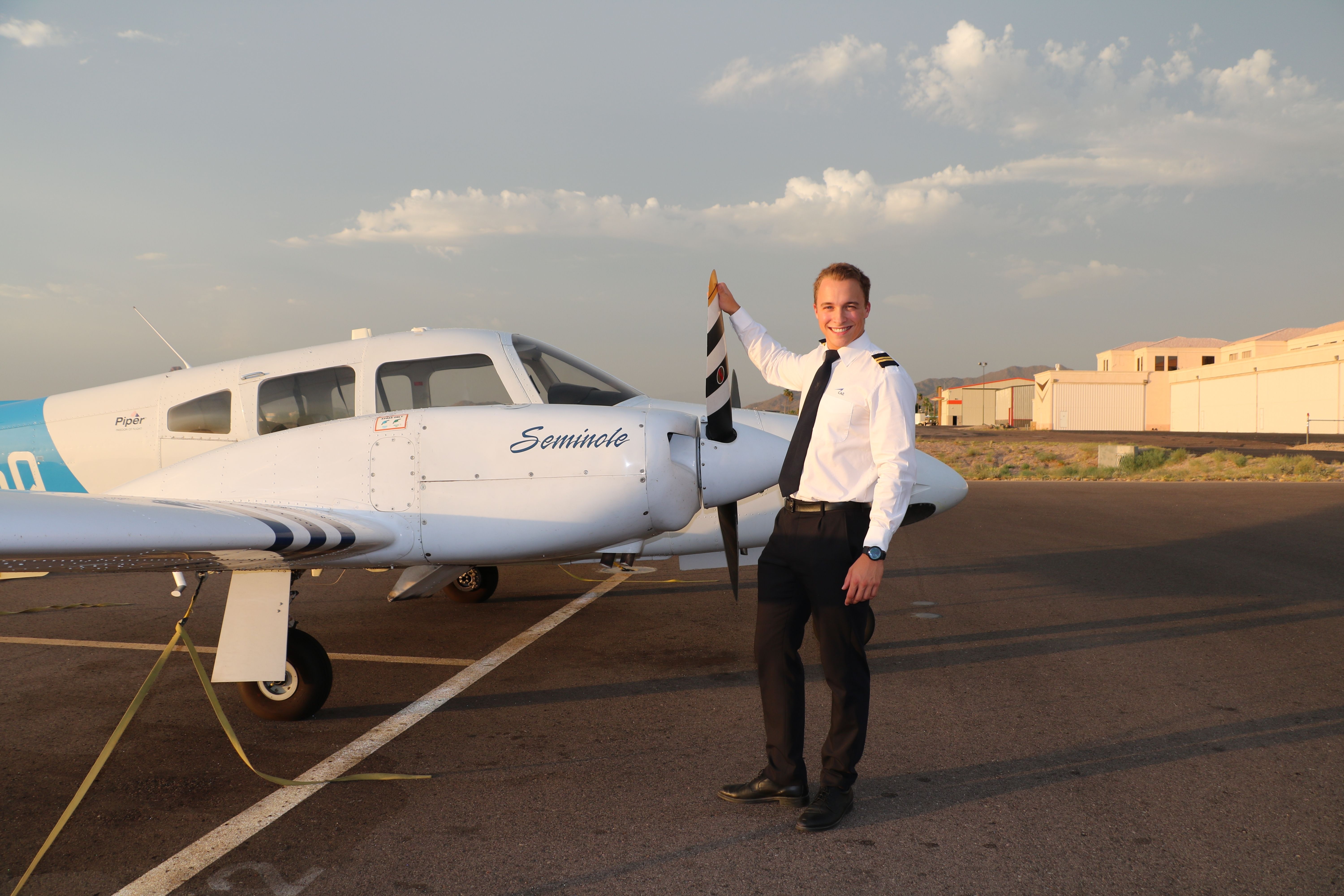A student pilot near the Shutterstock_2193600739 plane