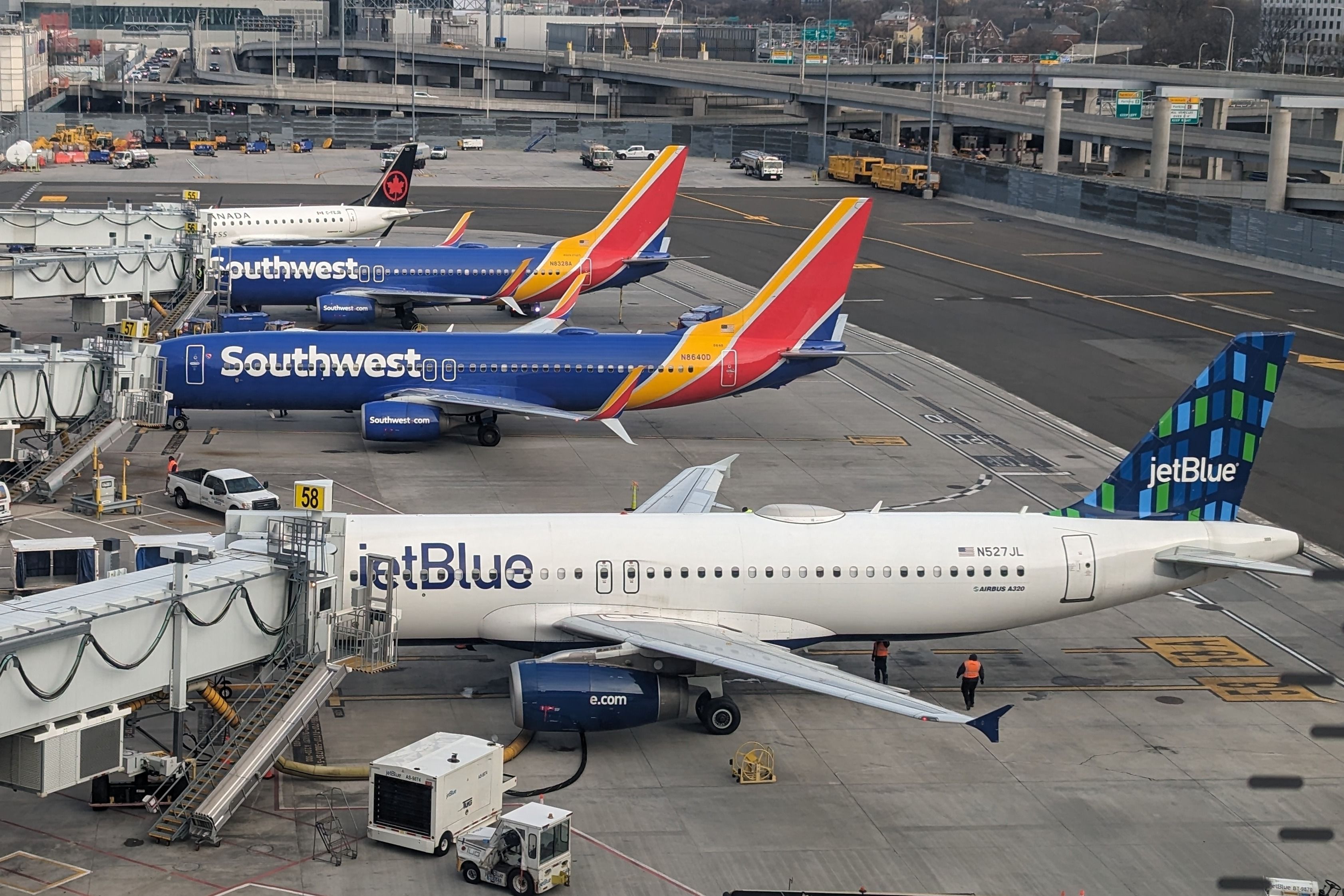 Air Canada, JetBlue, and Southwest Airlines aircraft at LGA shutterstock_2473321107