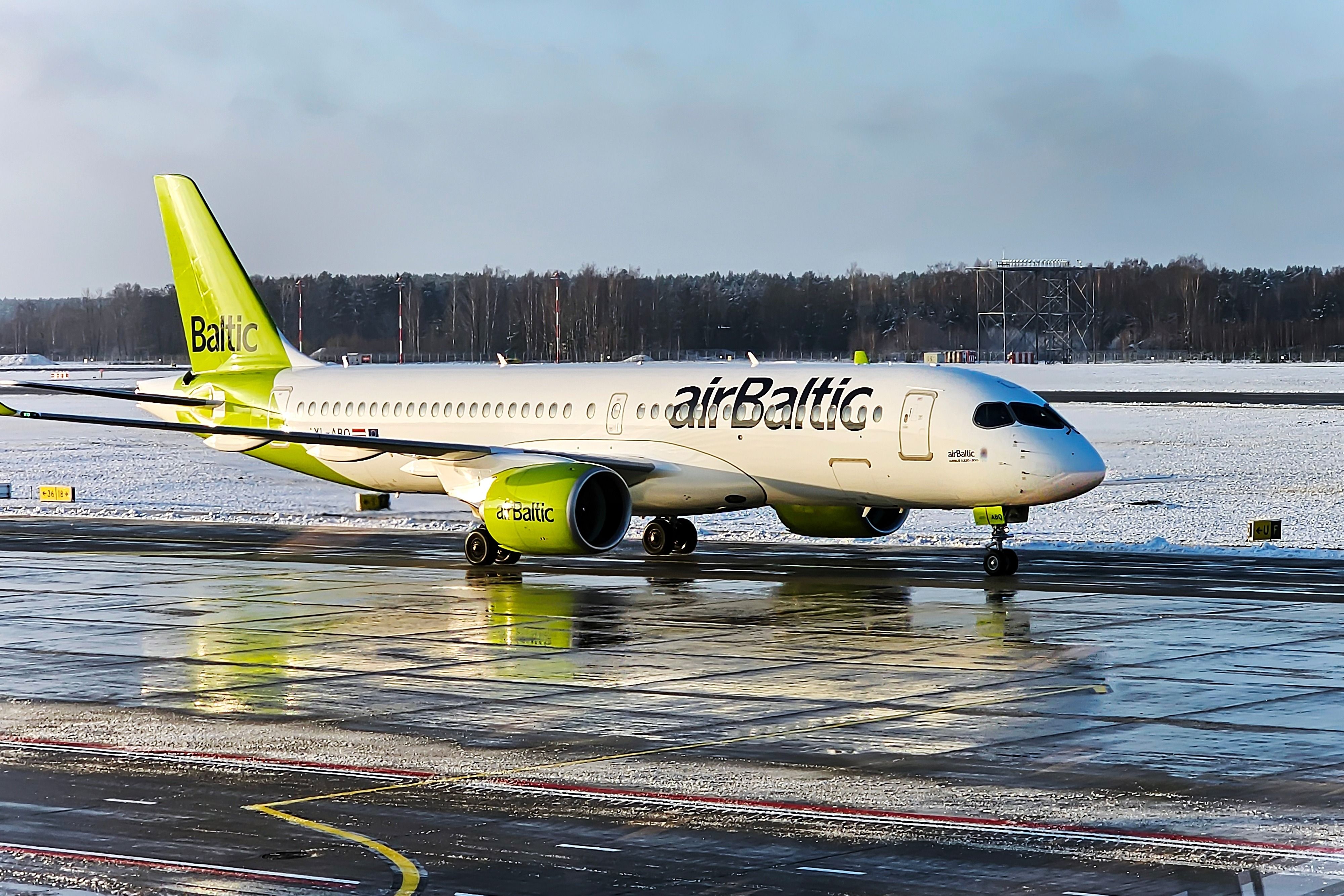 Airbaltic Airbus A220-300 Taxi in Rix Shutterstock_2413337443