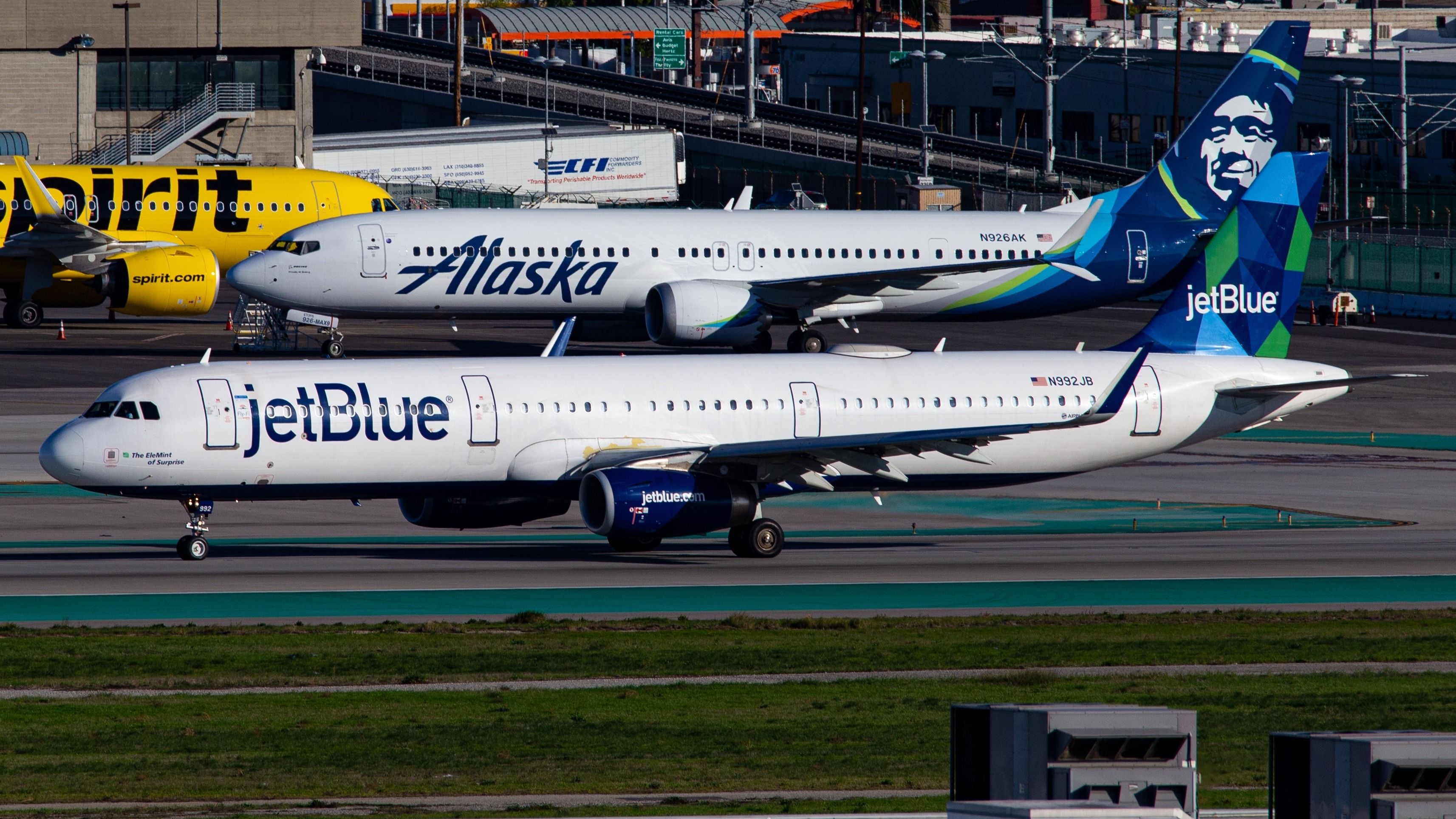 Alaska Airlines, JetBlue, and Spirit Airlines aircraft at LAX shutterstock_2453240129