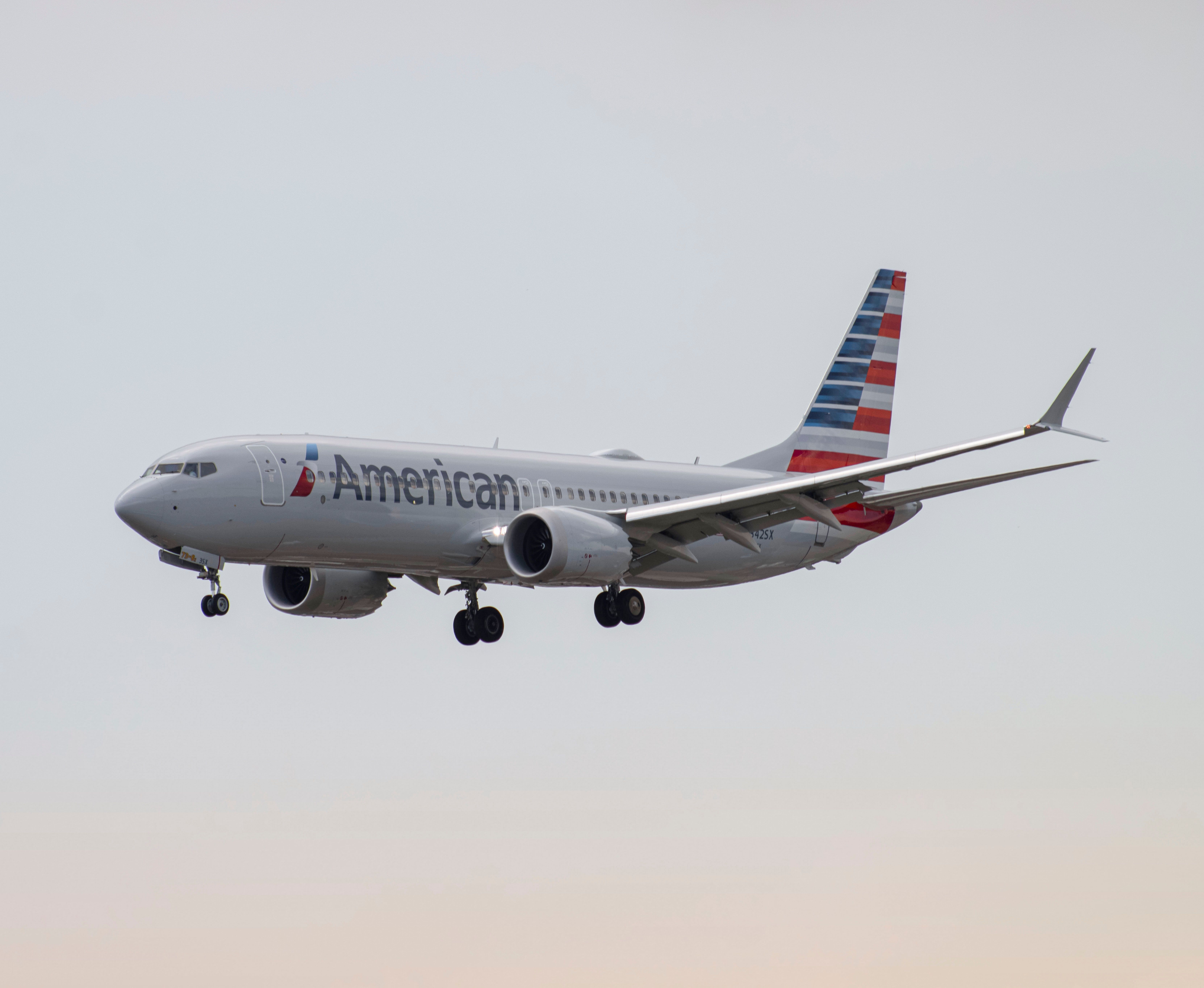 American Airlines Boeing 737 MAX 8 landing at LaGuardia Airport LGA shutterstock_2334382485