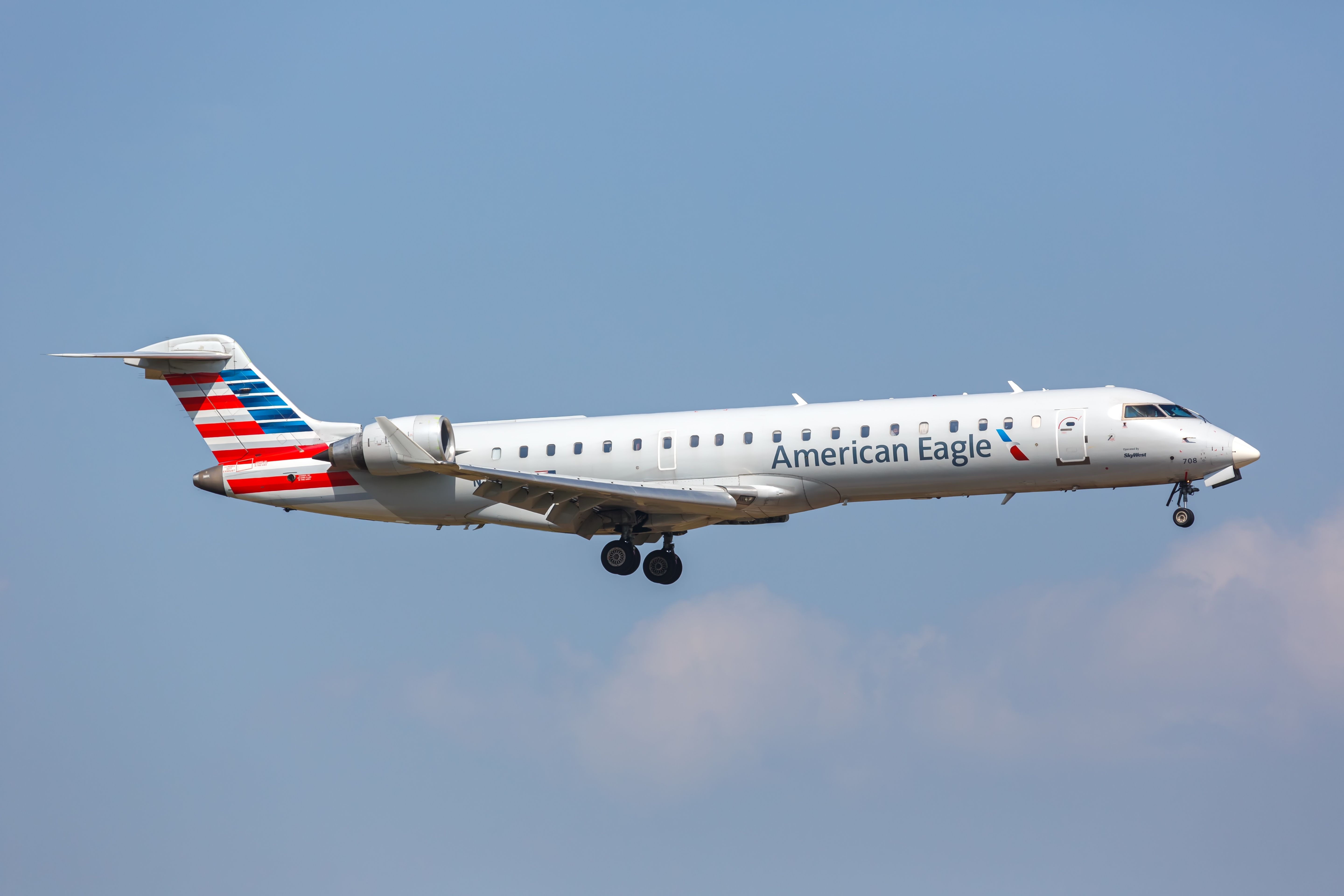 American Eagle Mitsubishi CRJ700 landing at DFW shutterstock_2418144691