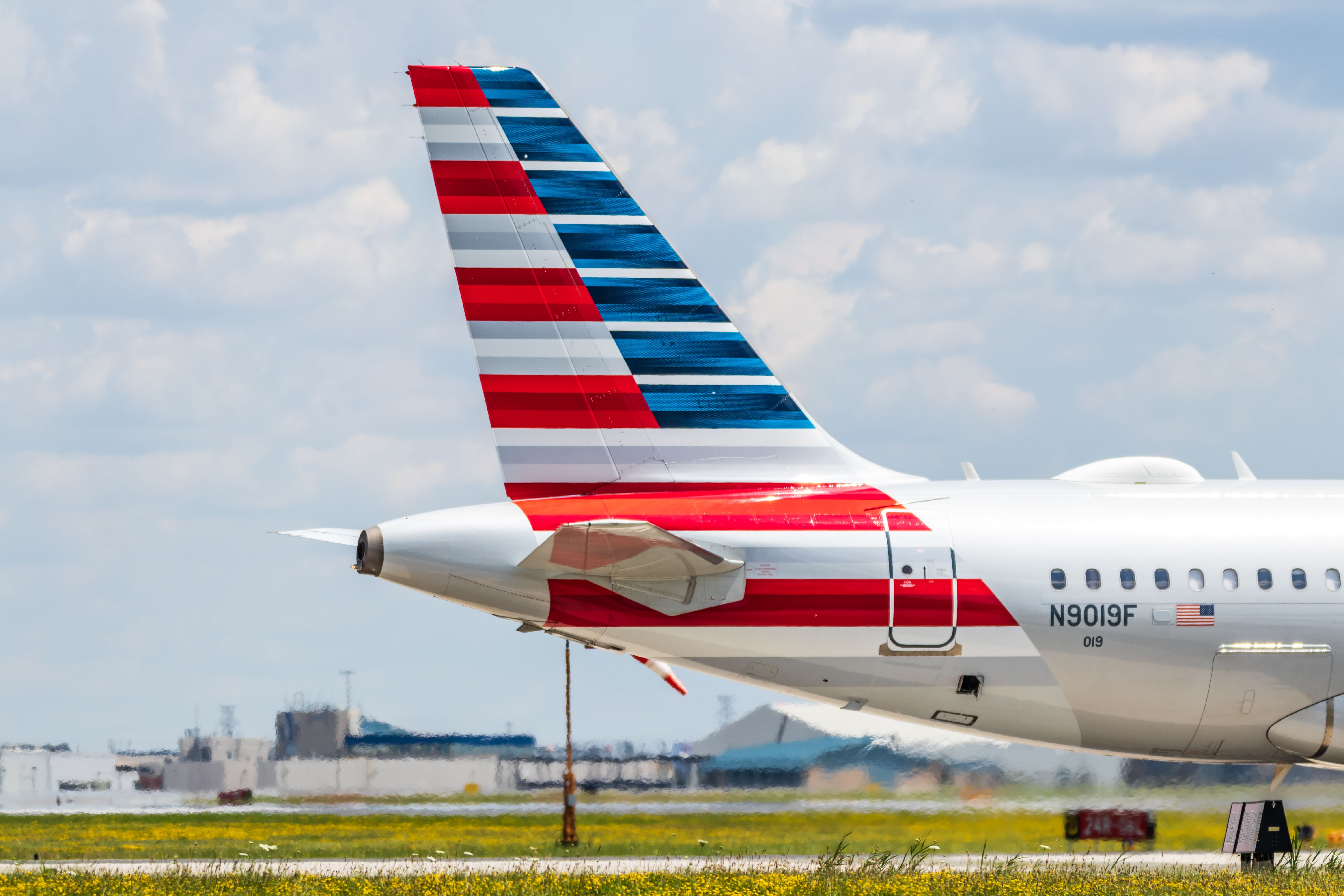 Tail of an American Airlines aircraft at Toronto Pearson International Airport YYZ shutterstock_1476411944