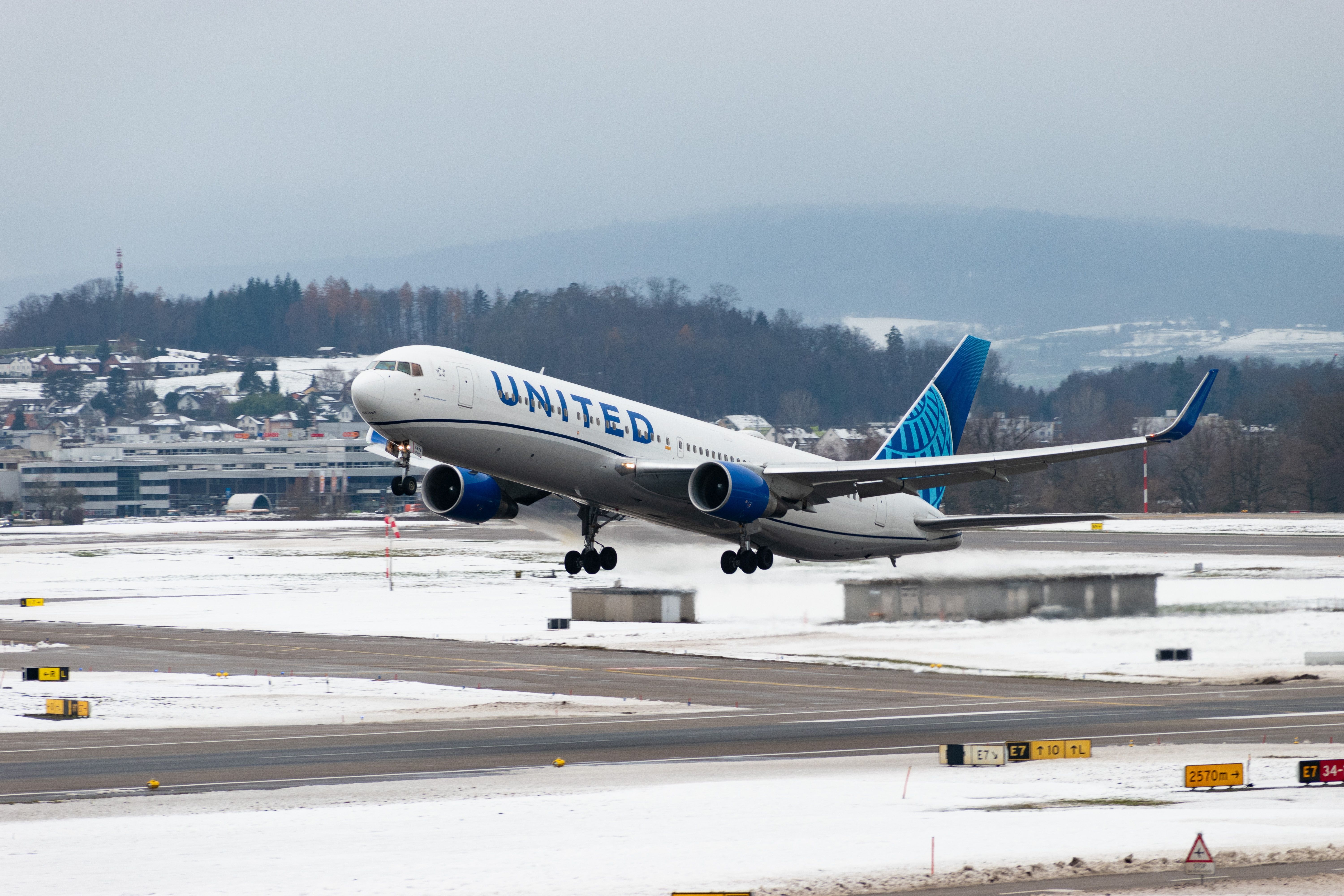 United Airlines Boeing 767 departing Zurich Airport ZRH shutterstock_2404884831