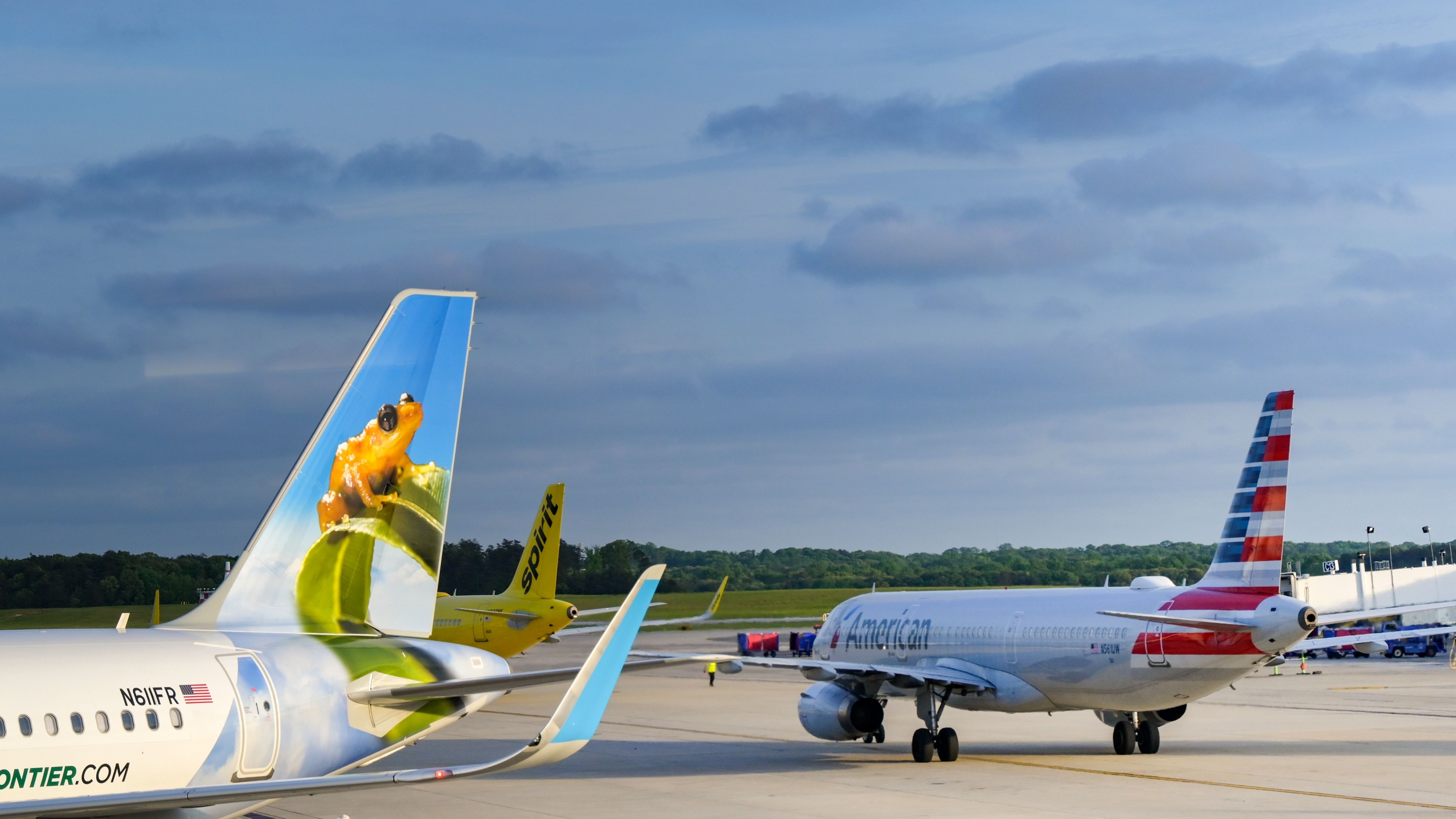 American Airlines, Frontier Airlines, and Spirit Airlines aircraft at BWI shutterstock_2462154681