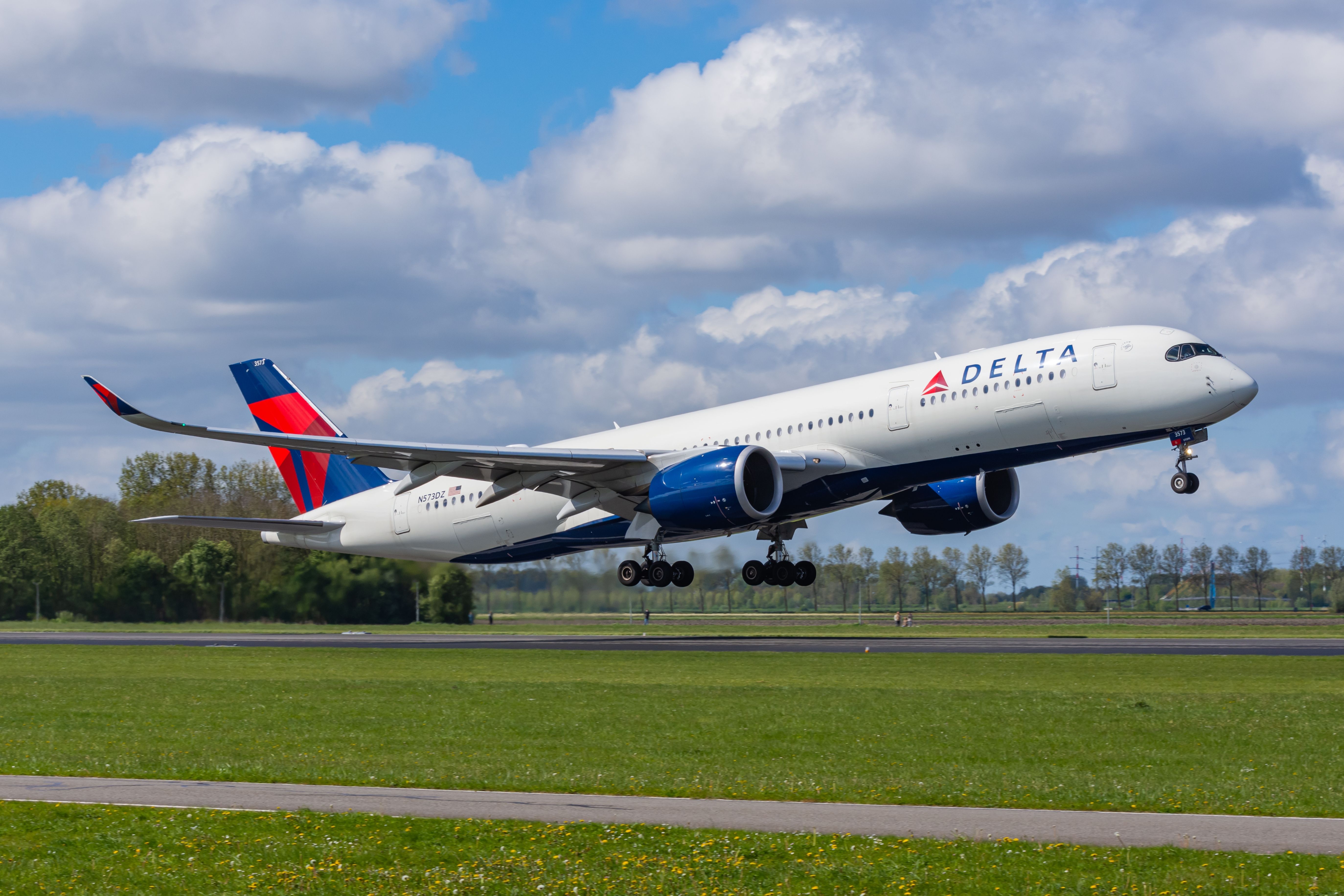 Delta Air Lines Airbus A350-900 departing Amsterdam Schiphol Airport AMS shutterstock_2466444049