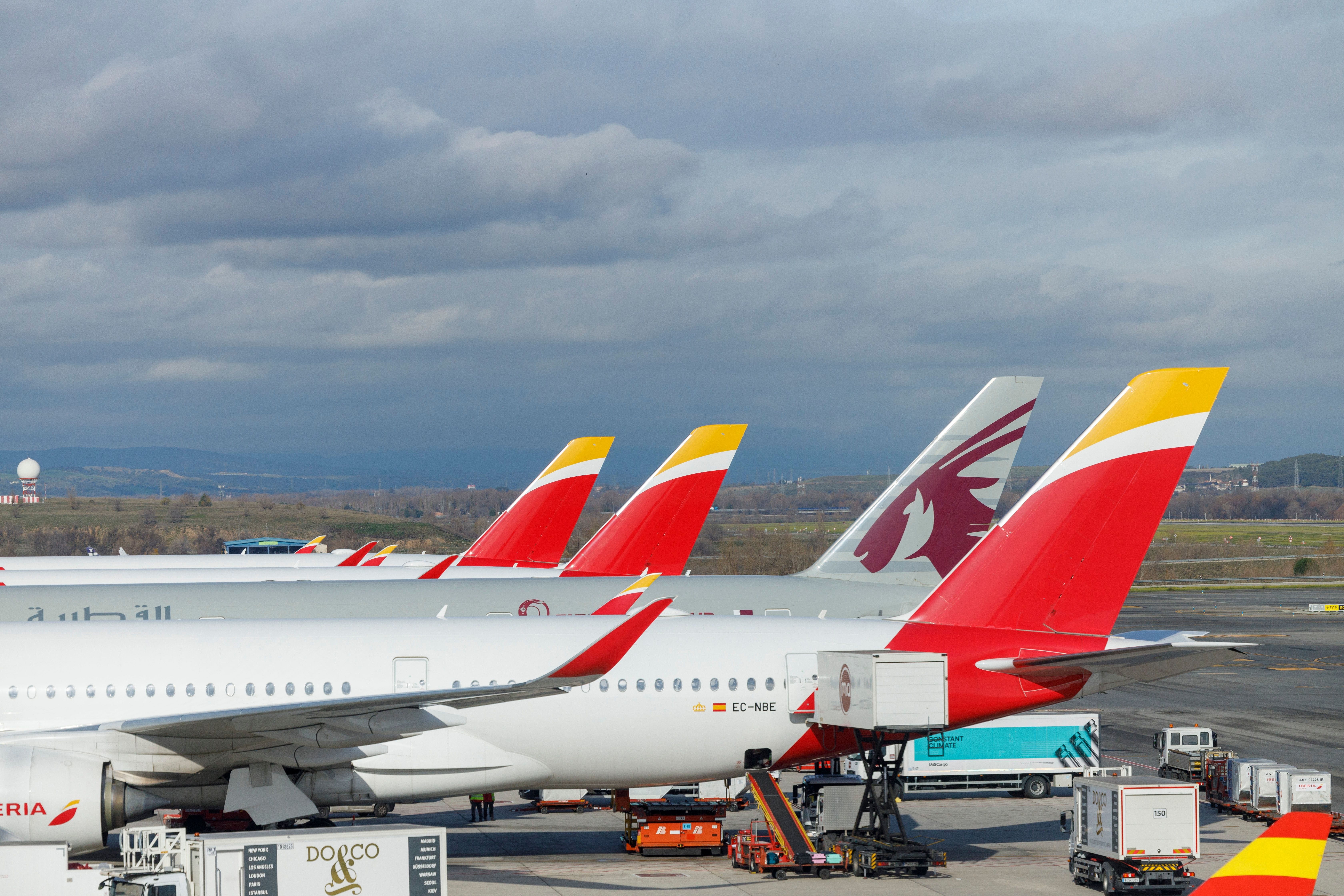 Iberia and Qatar Airways aircraft at the Madrid-Barajas Mad Shuttersock_2241189045 airport
