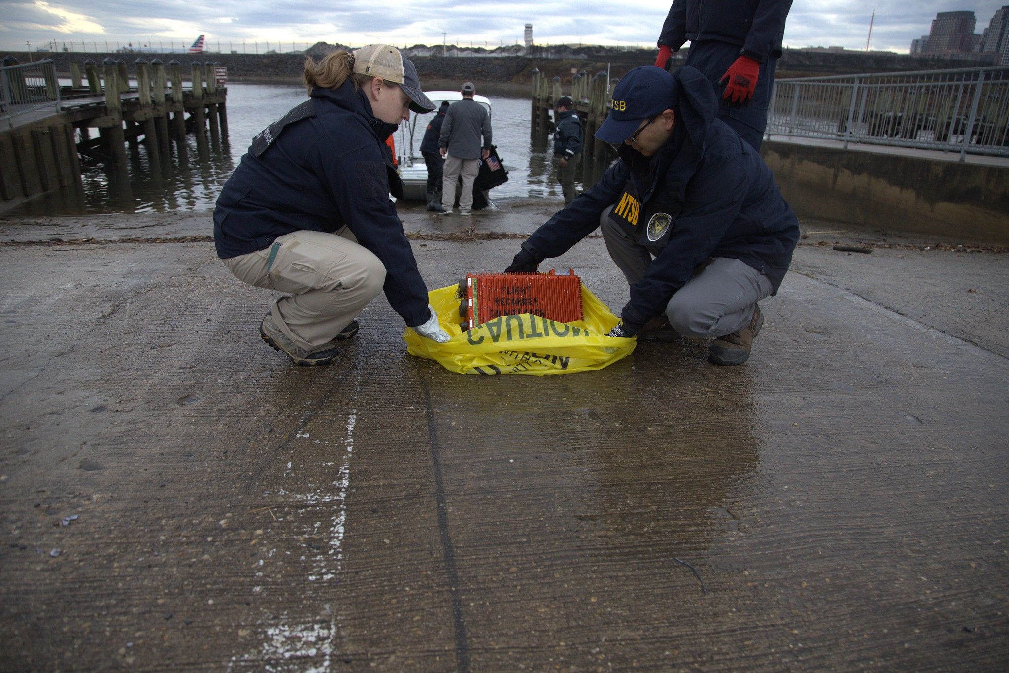 NTSB personnel recovering the black box of the CRJ700